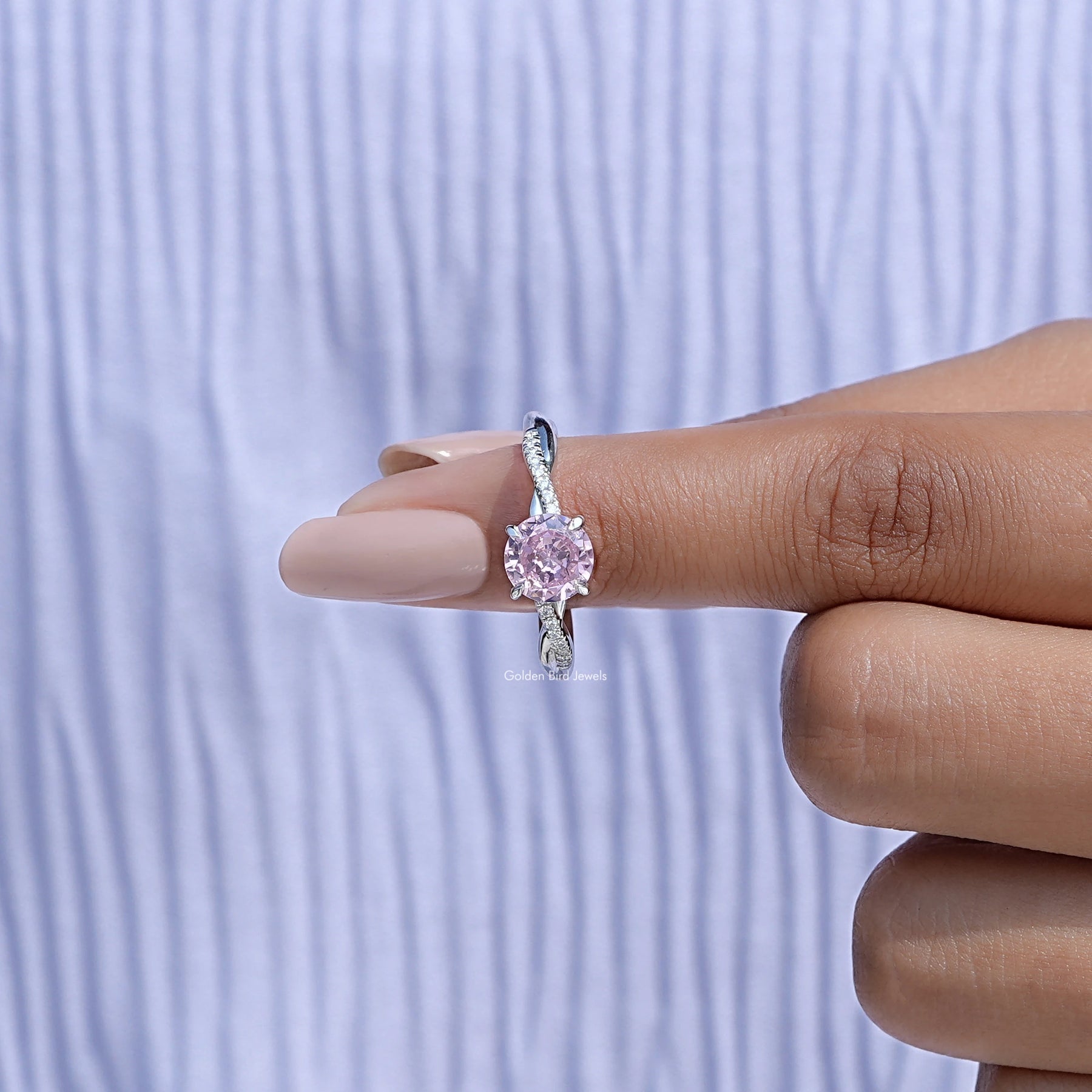 In finger front View of Round Cut Gemstone Accent Ring In White Gold