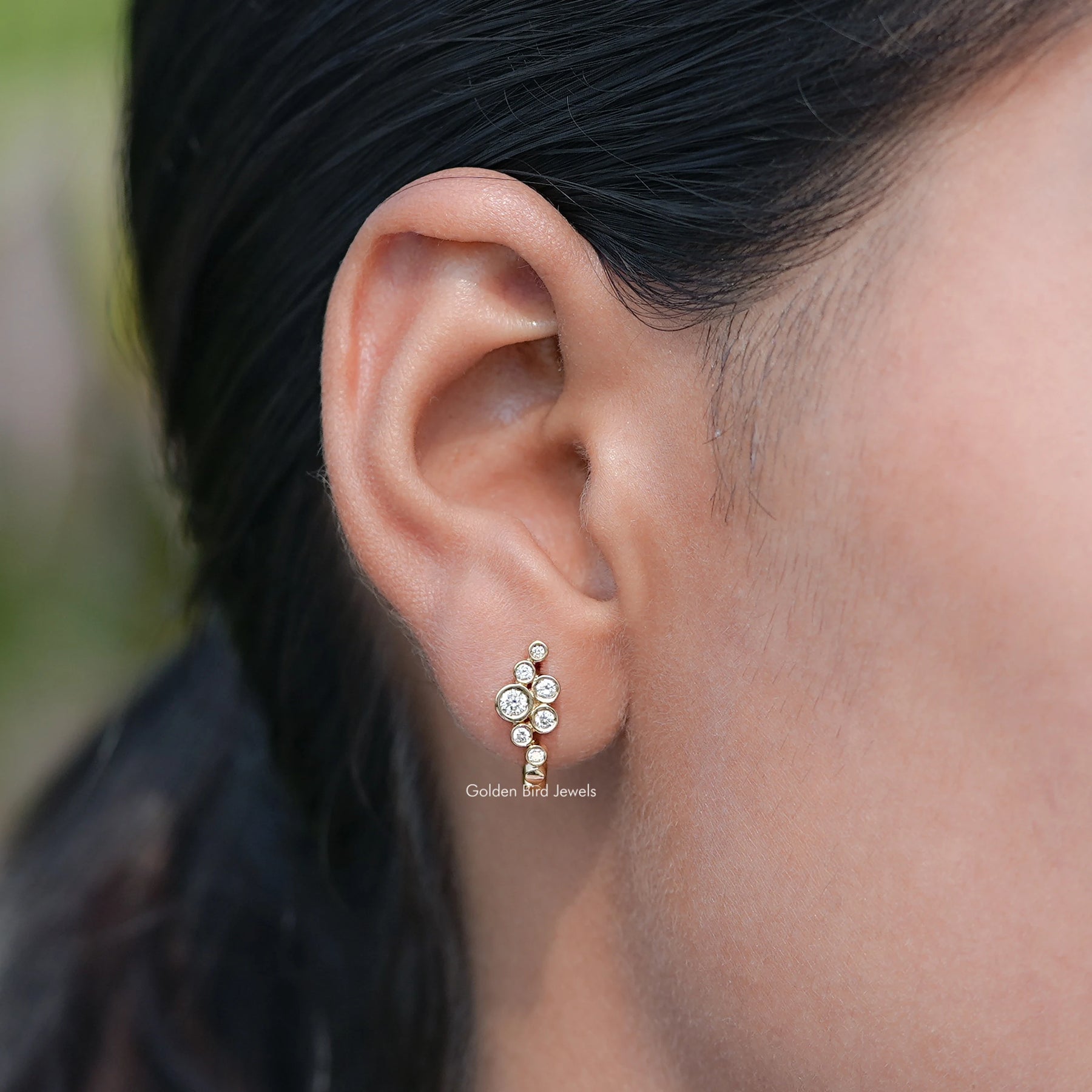 In Ear View Of Round Lab Diamond Bezel Set U Shape Hoop Earrings in four prongs setting
