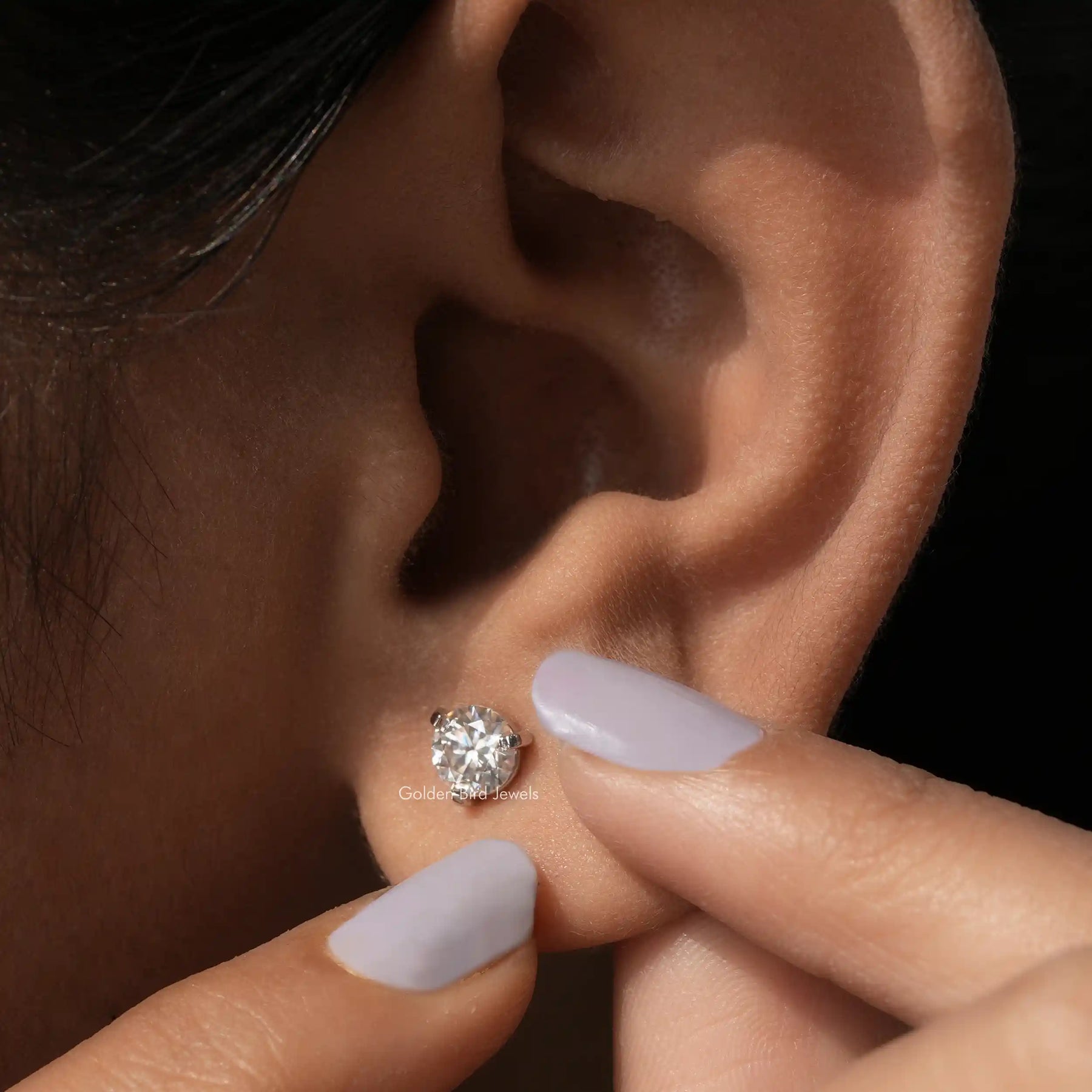 In ear front view of martini setting earrings