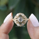 Front View of Round Cut Moissanite Vintage Engagement Ring In two Fingers