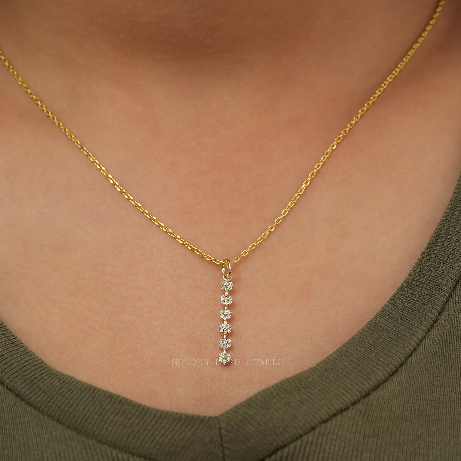 In neck view of floral moissanite halo pendant