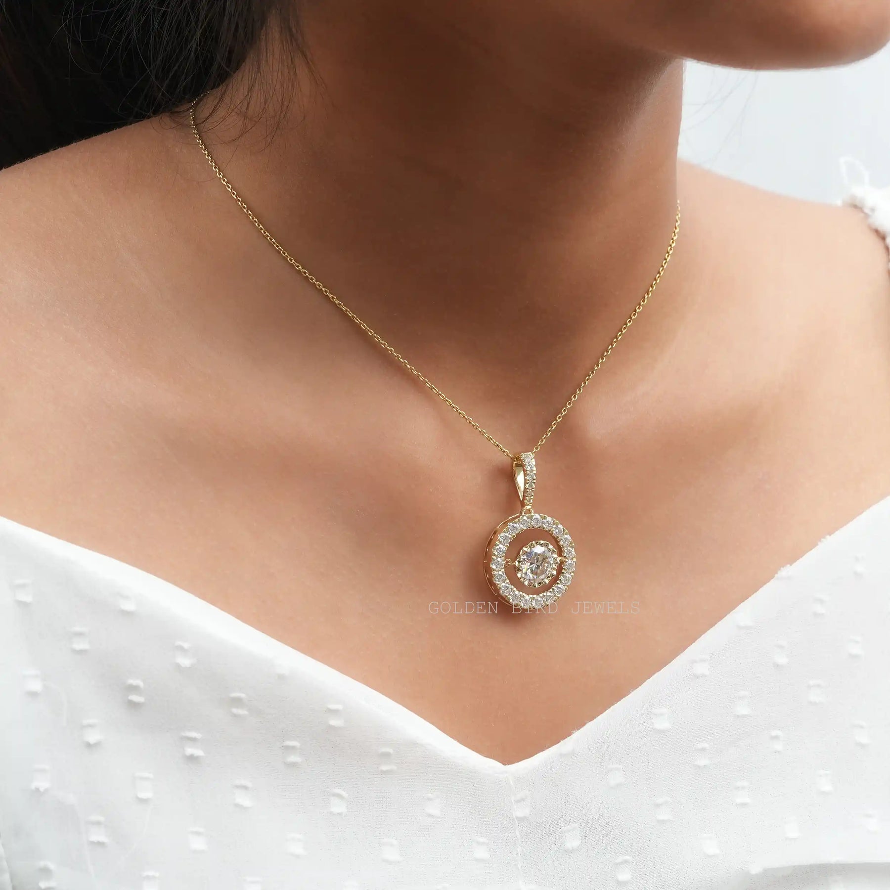 Round cut moissanite pendant crafted with 14k yellow gold
