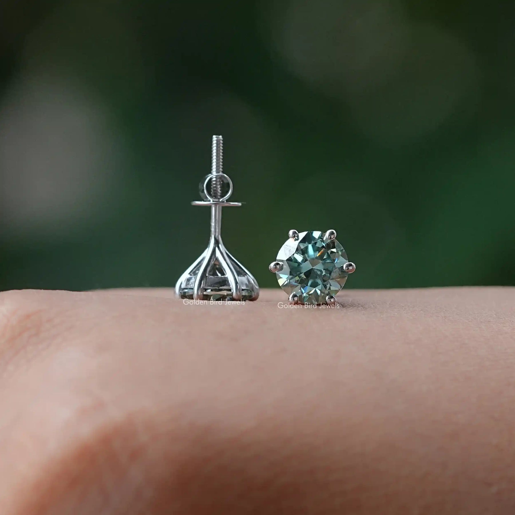 Front and back view of solitaire stud earrings crafted in moissanite
