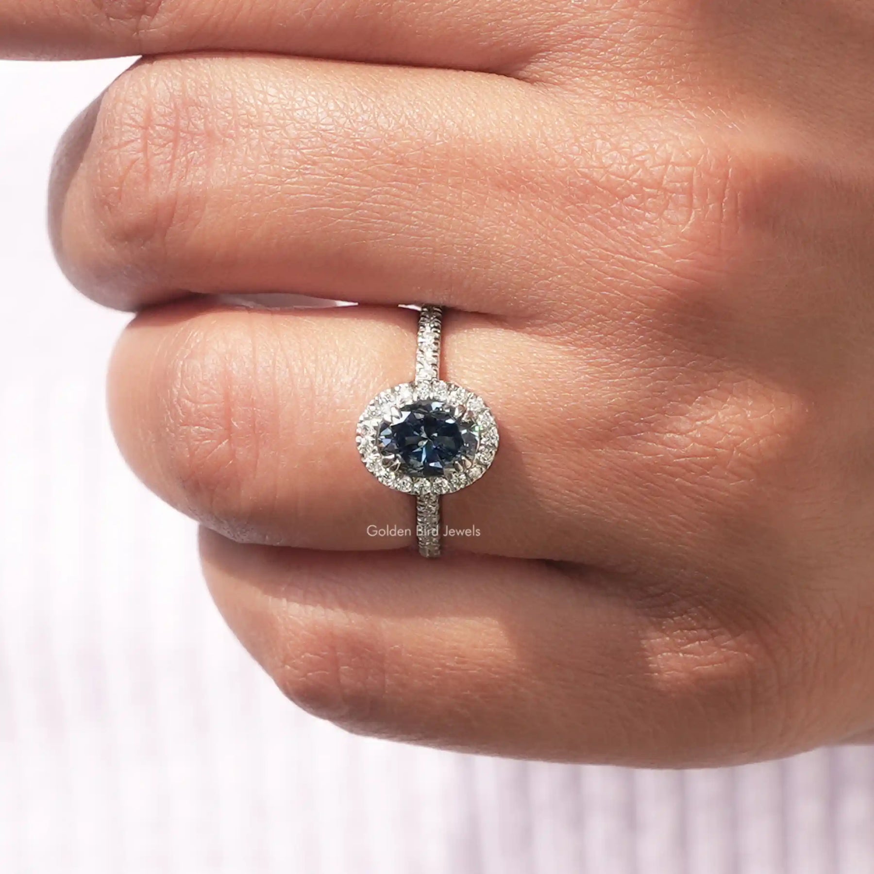 Detailed View Of Sapphire Blue Oval Cut Engagement Ring In White Gold