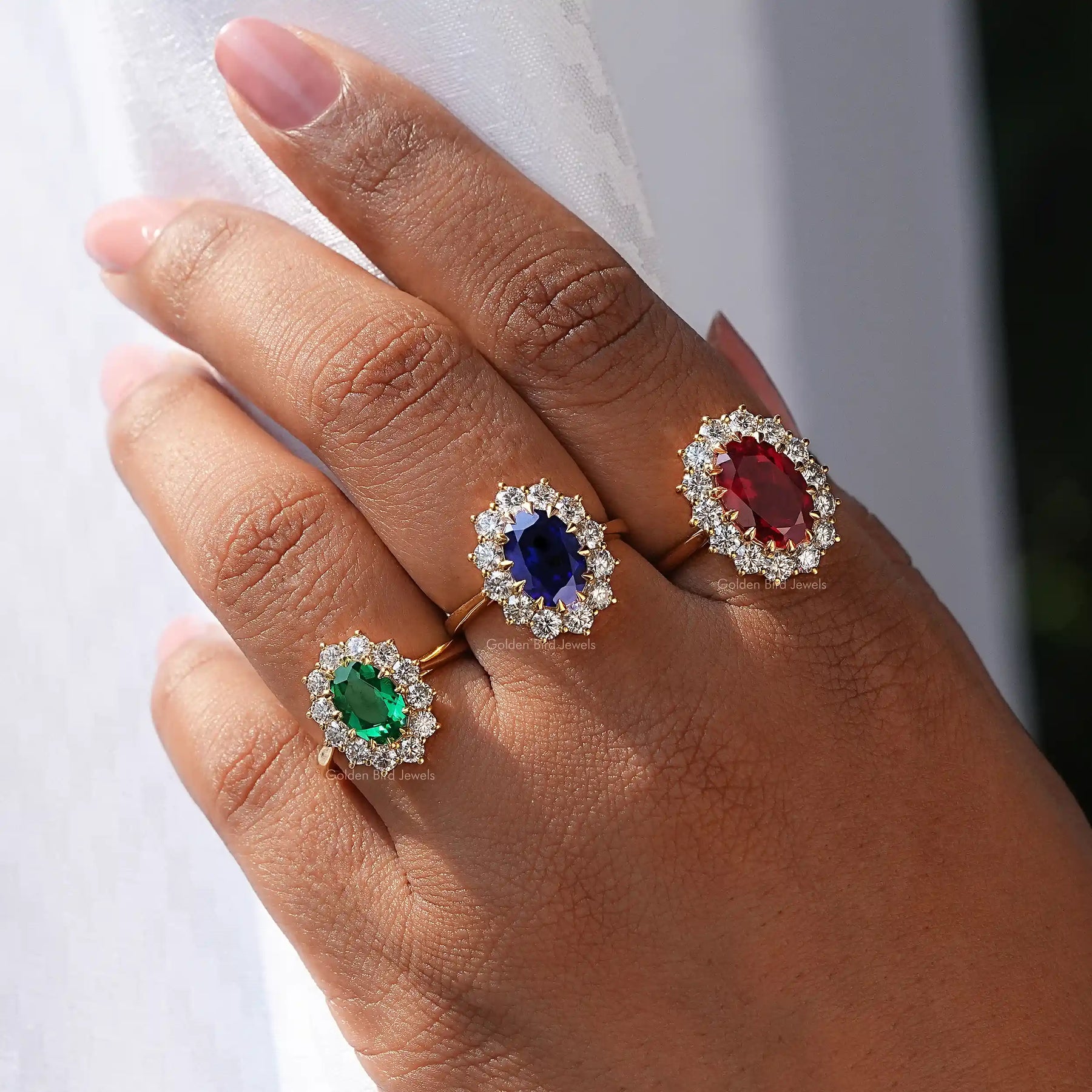 View of Oval Gemstone Halo Engagement Ring In finger