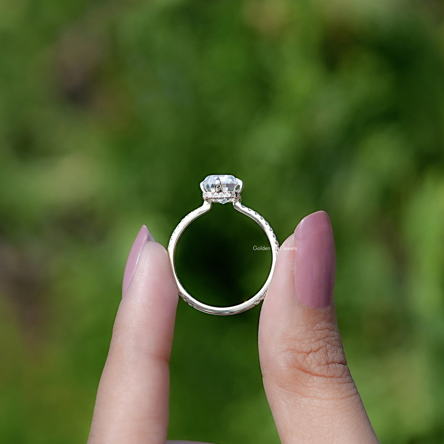 Back view of Emerald Cut Moissanite Hidden Halo Engagement Ring in secure setting