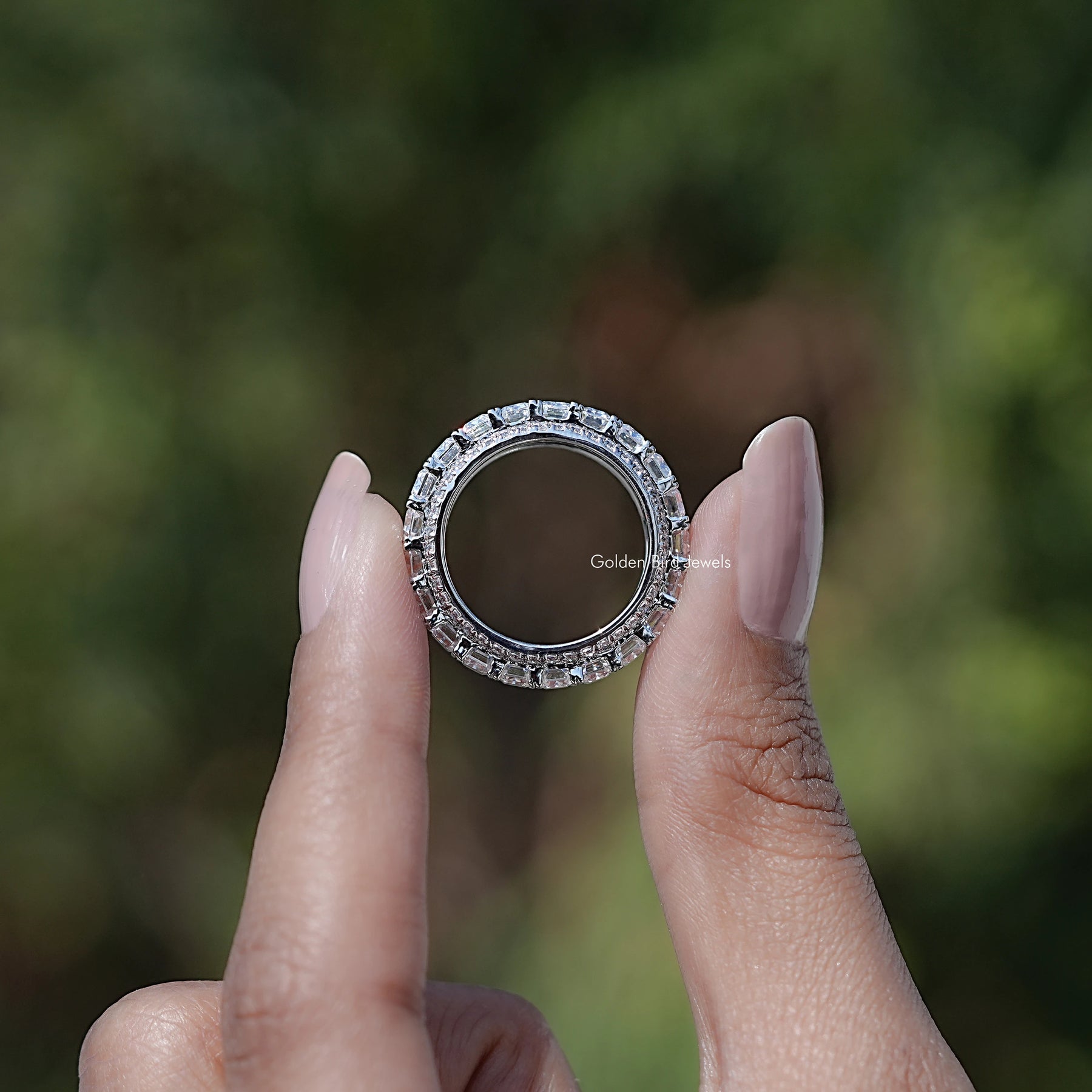 Back view of Emerald and Round Cut moissanite three row band