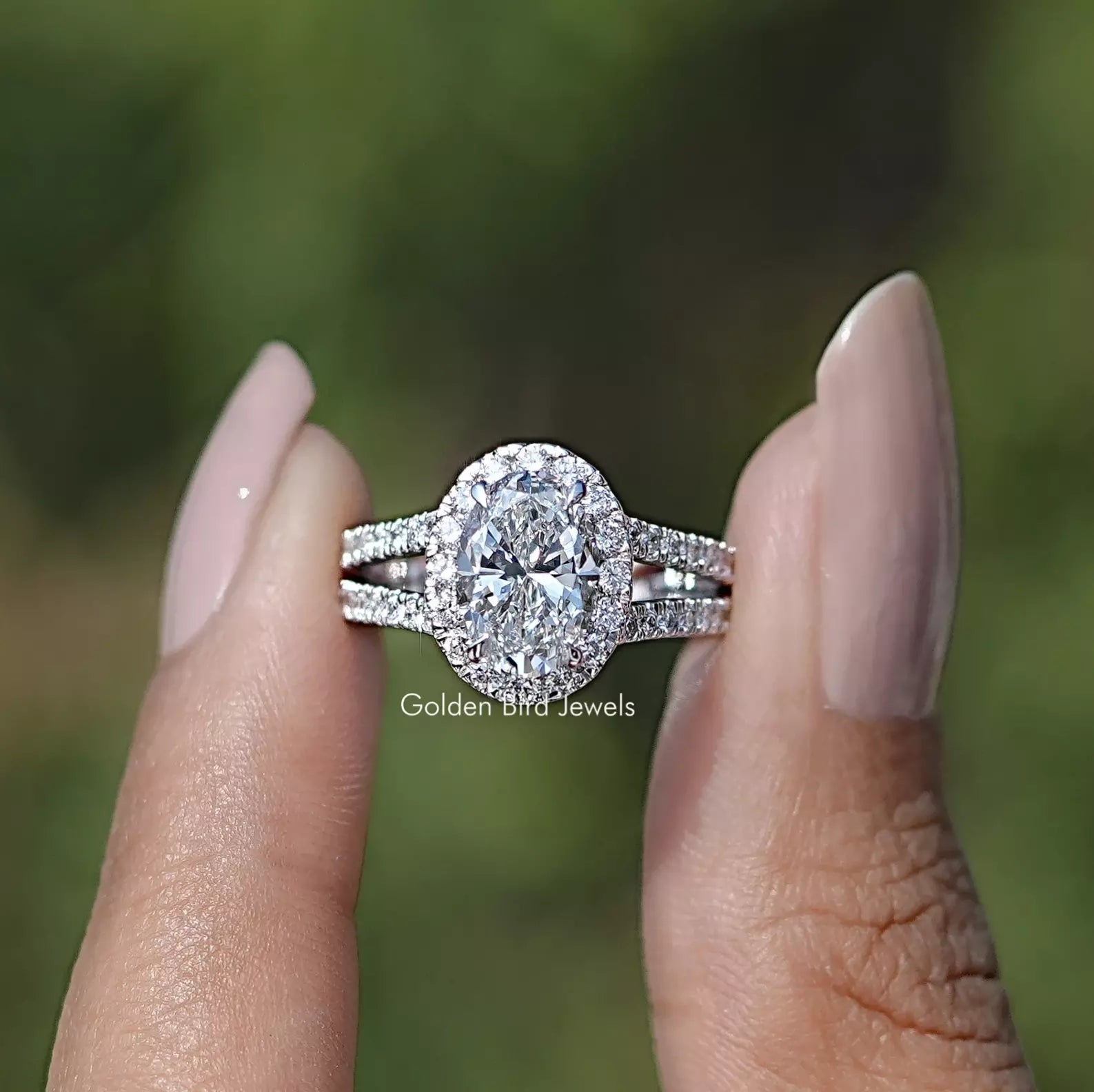 Front view of Diamond Split Shank Engagement Ring holding in two fingers