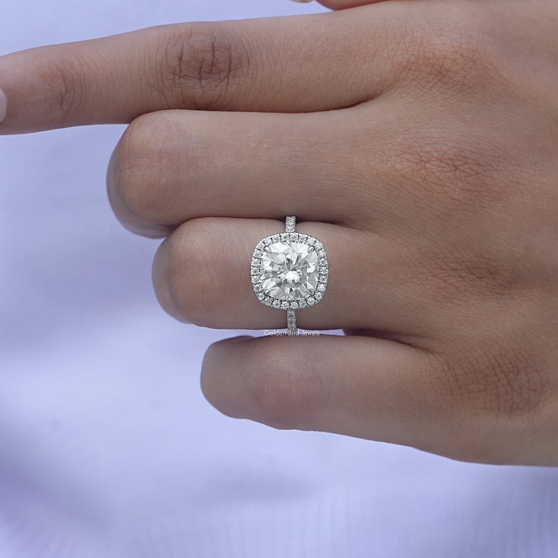 View of Cushion Cut Diamond Halo Engagement Ring In White Gold