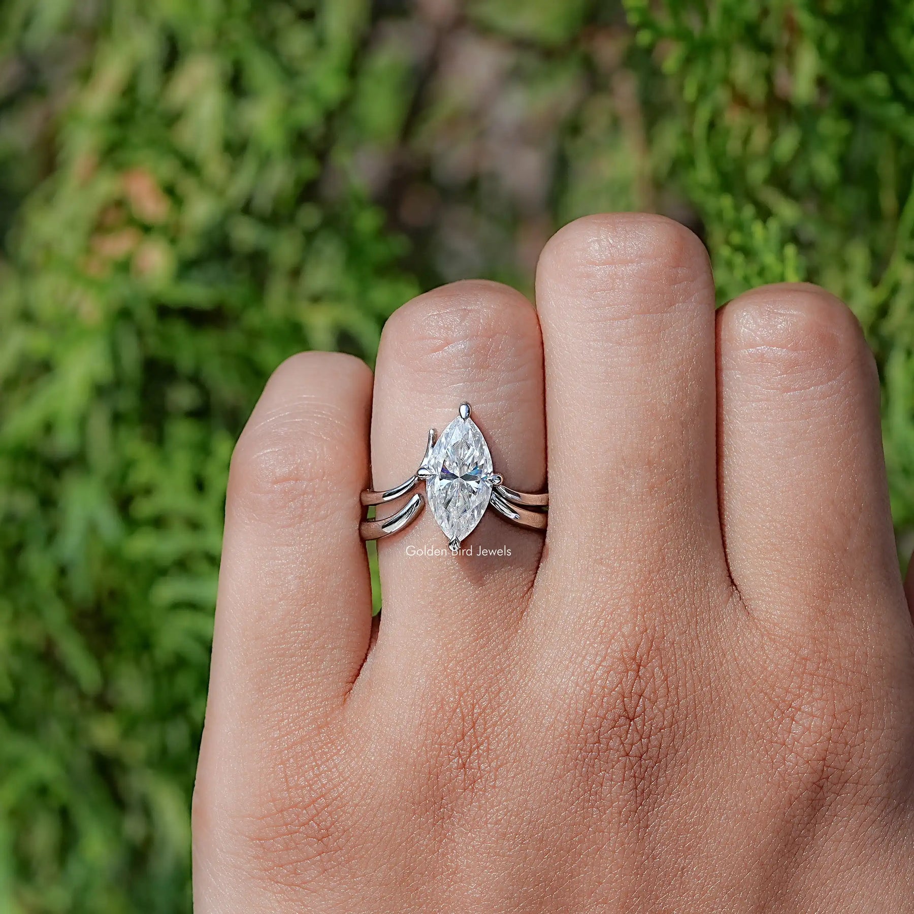 In finger front view of Marquise Cut Moissanite Solitaire Chevron Ring