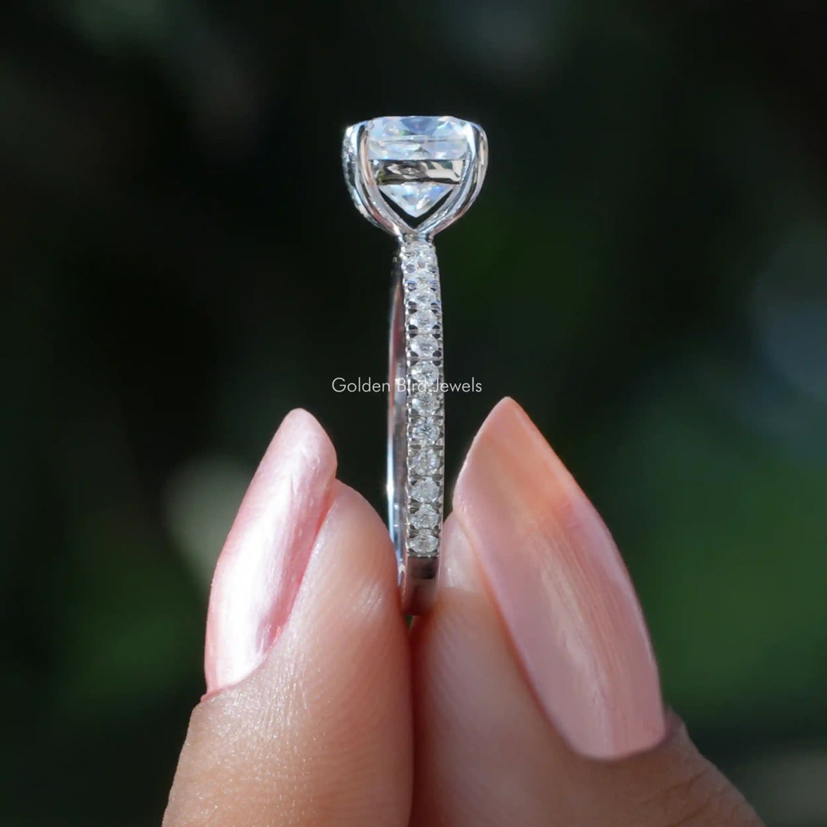 Side View of Cushion Cut Moissanite Engagement Ring In finger