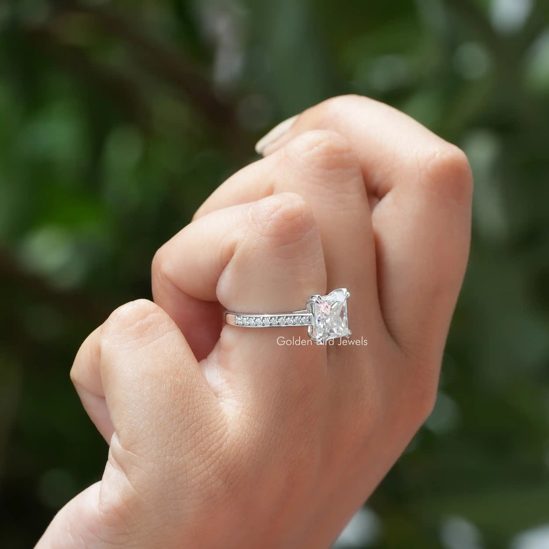 View of moissanite solitaire princess cut ring In Finger