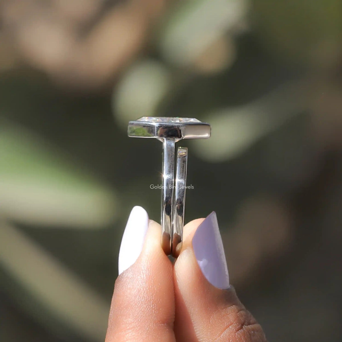 Side view of colorless marquise moissanite bridal set ring