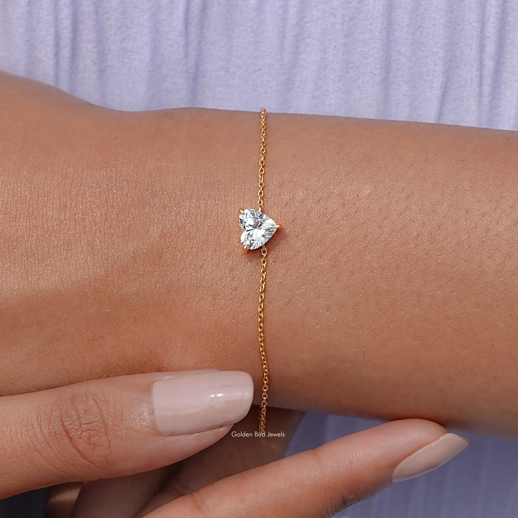 Close view of heart shaped chain bracelet in secure setting