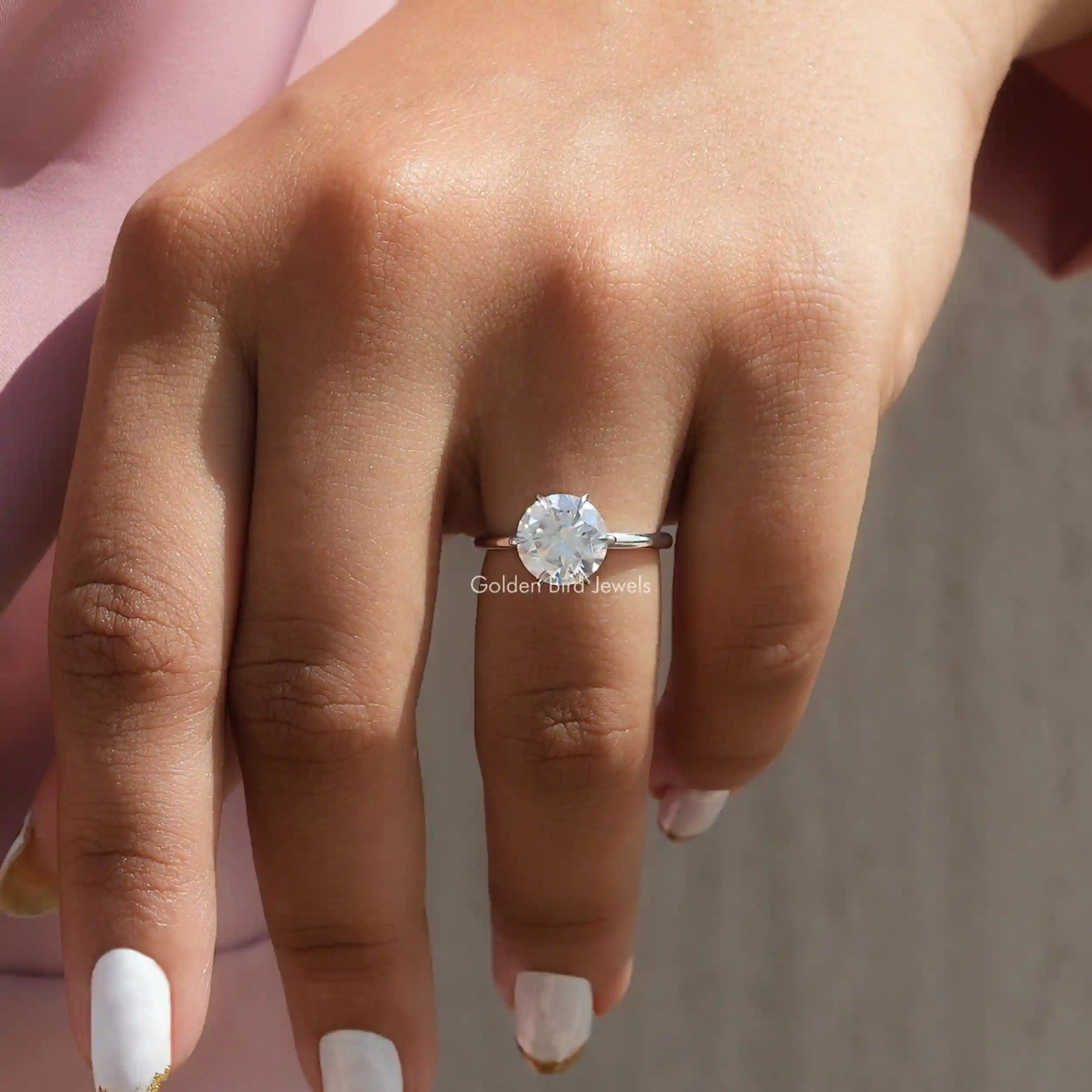 View of Round Cut Moissanite Solitaire Engagement Ring In Finger