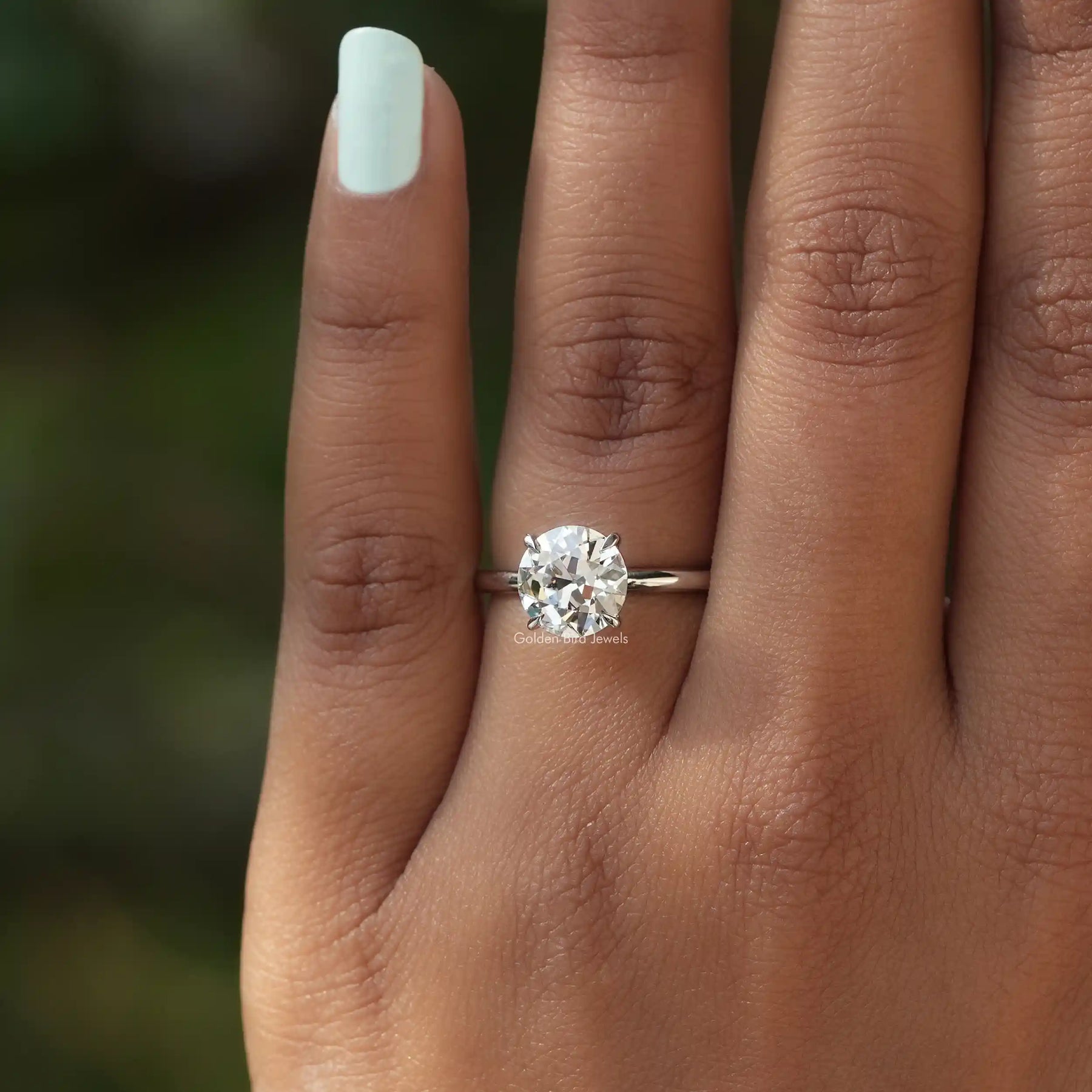 Close-Up View of Round Cut Diamond Engagement Ring In White Gold