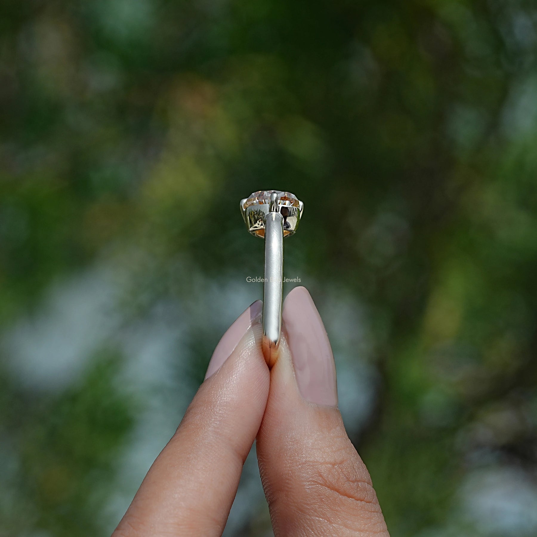 Side Stone View of Pear Shape Moissanite Ring