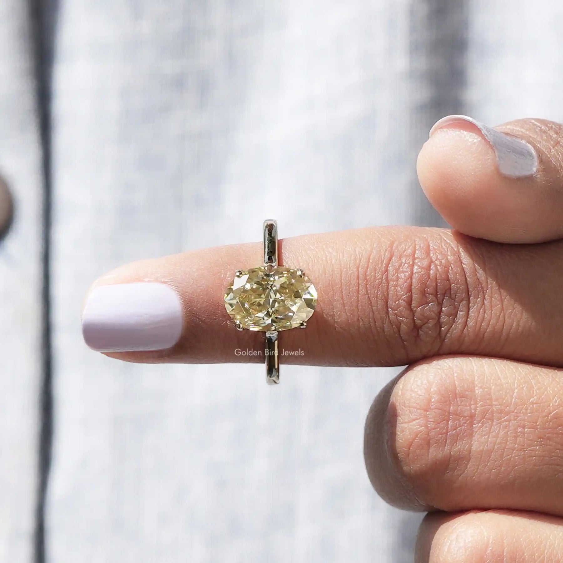 In finger front View of Solitaire Oval Cut Moissanite Engagement Ring