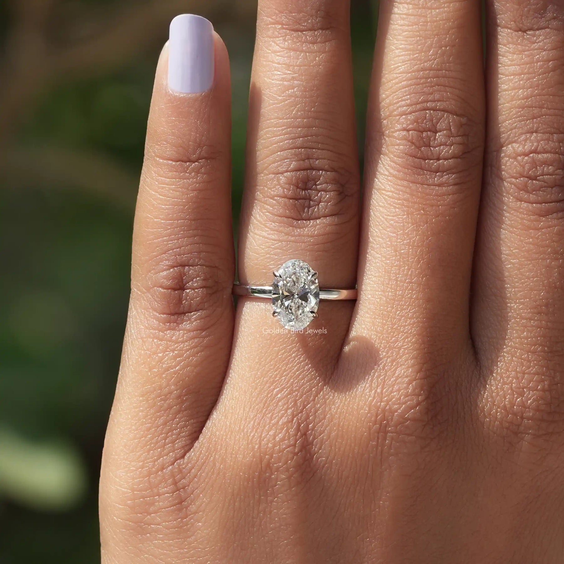 Close-Up View of Oval Cut Solitaire Engagement Ring In White Gold
