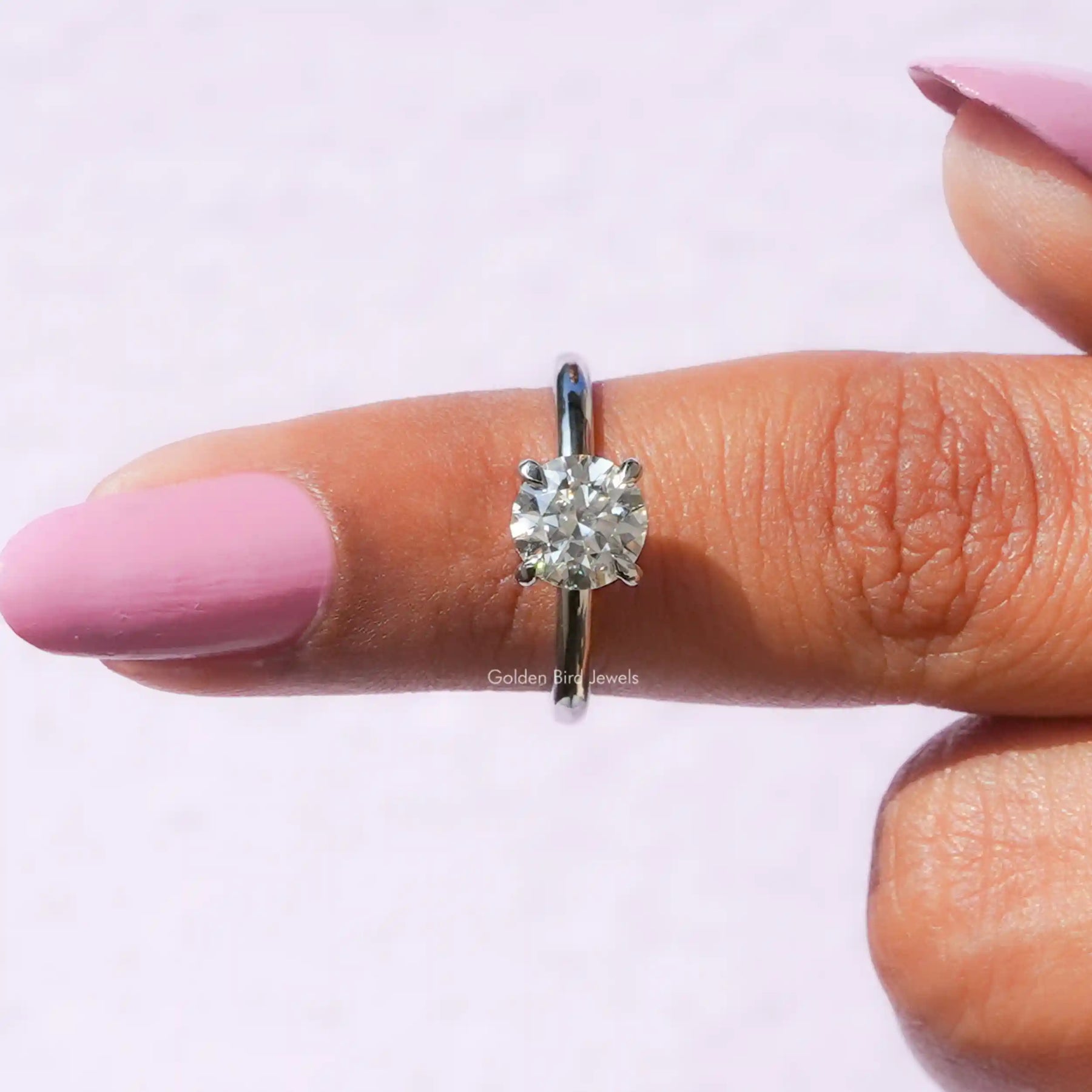In finger front View of Round Cut Moissanite Engagement Ring