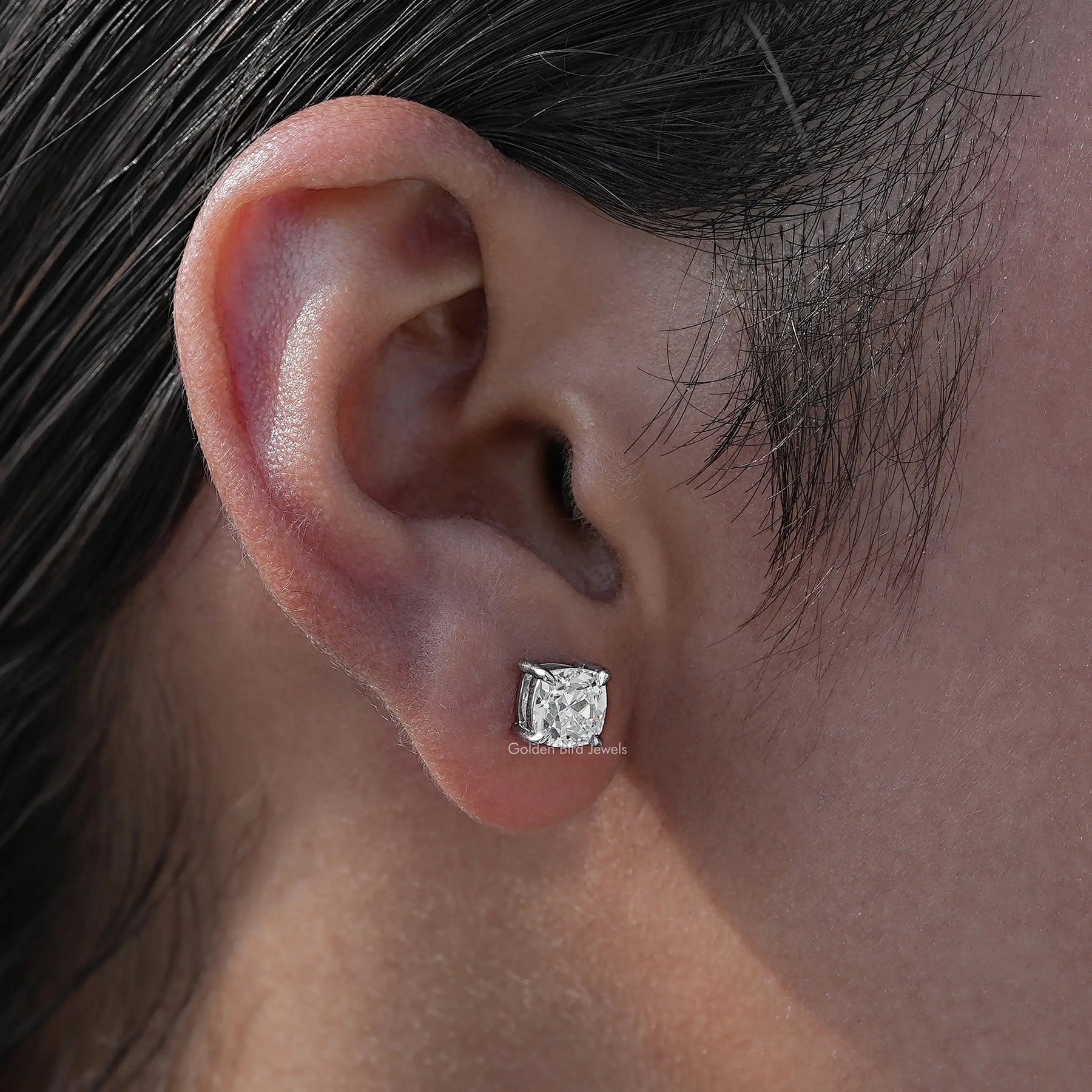 Close view of old mine square cut diamond stud earrings