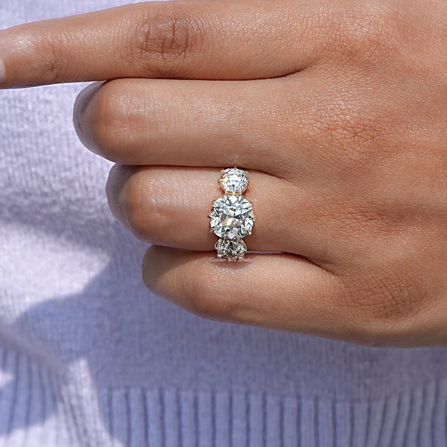 Close-Up View of Cushion Cut Diamond Engagement Ring In Yellow Gold