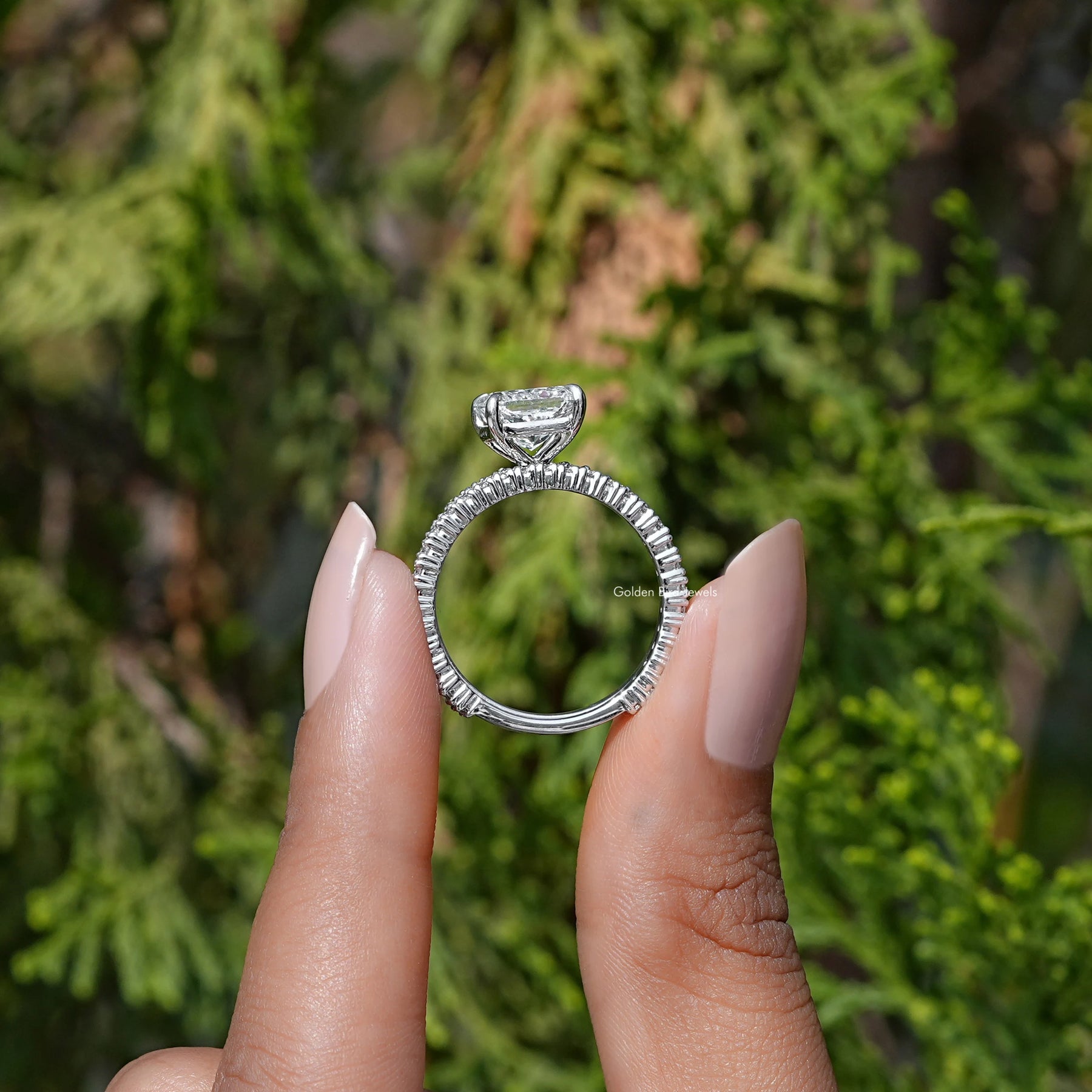 Back View of A Radiant Cut Lab Diamond Bridal Ring in two fingers