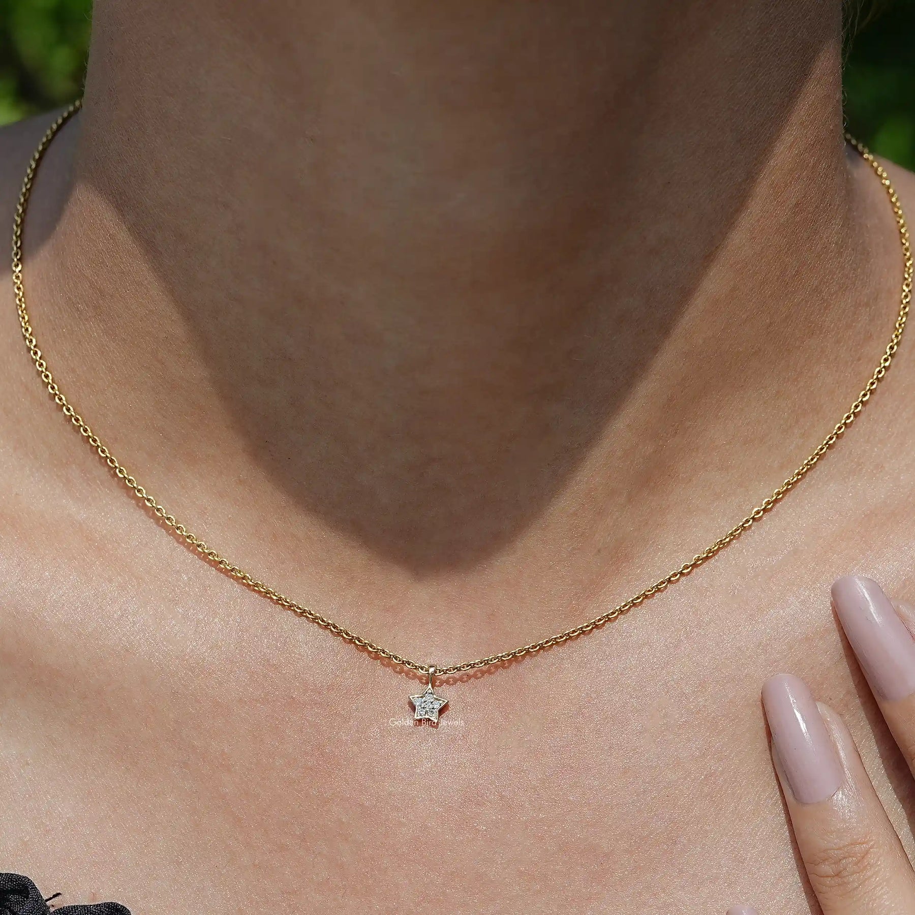 View of Star Shaped Round Cut Diamond Pendant In Yellow Gold