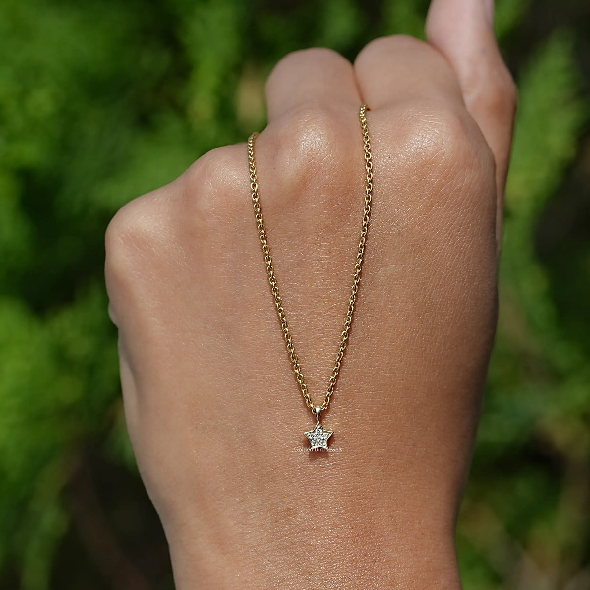 In Hand Holding Back View of the Round Cut Diamond Pave Set Pendant In Yellow Gold