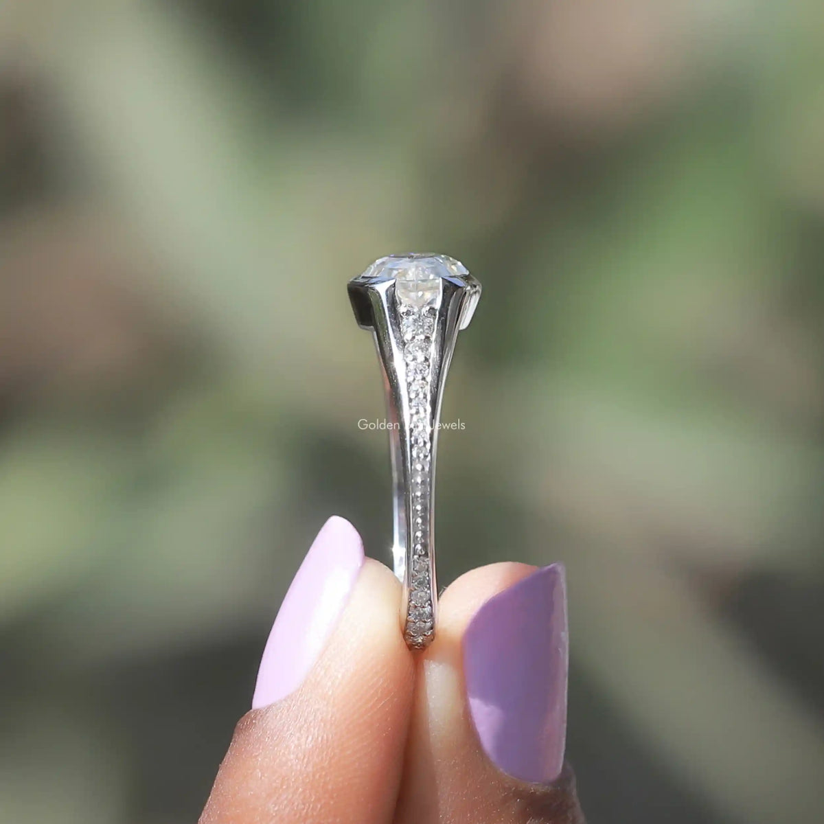 Side View of Moissanite Eternity Bridal Ring In two fingers