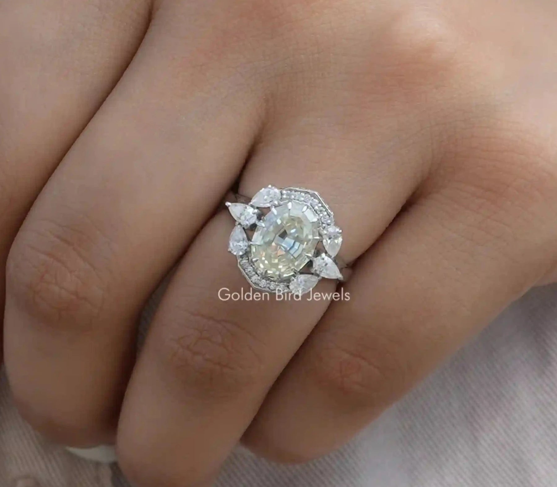 Step Cut Oval Moissanite Halo Ring In White Gold