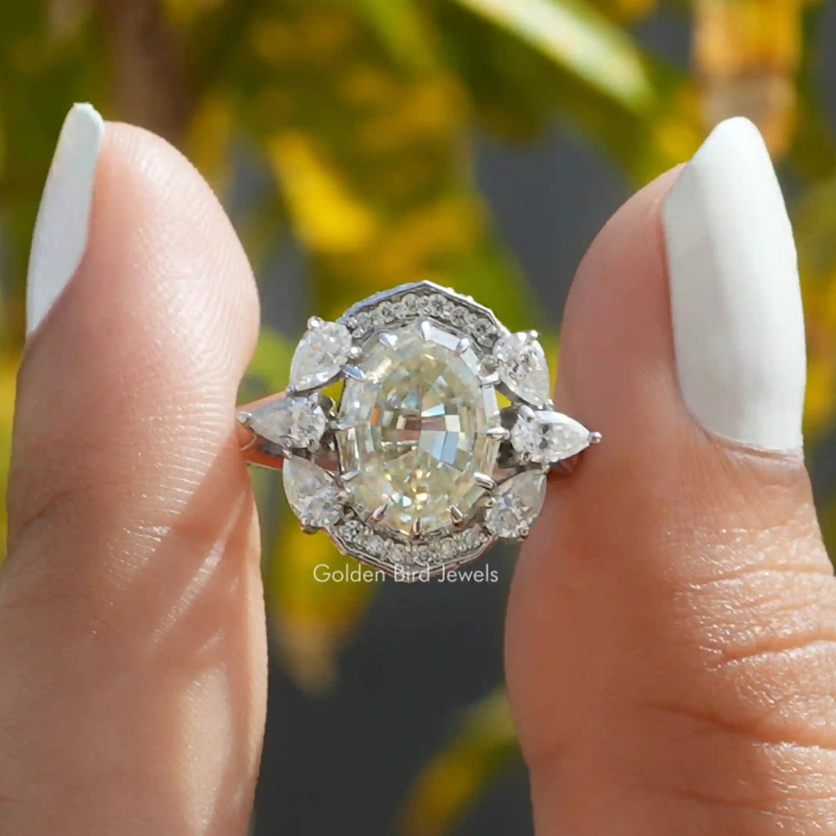 Front View of Step Cut Oval Halo Moissanite Vintage Ring In two Fingers