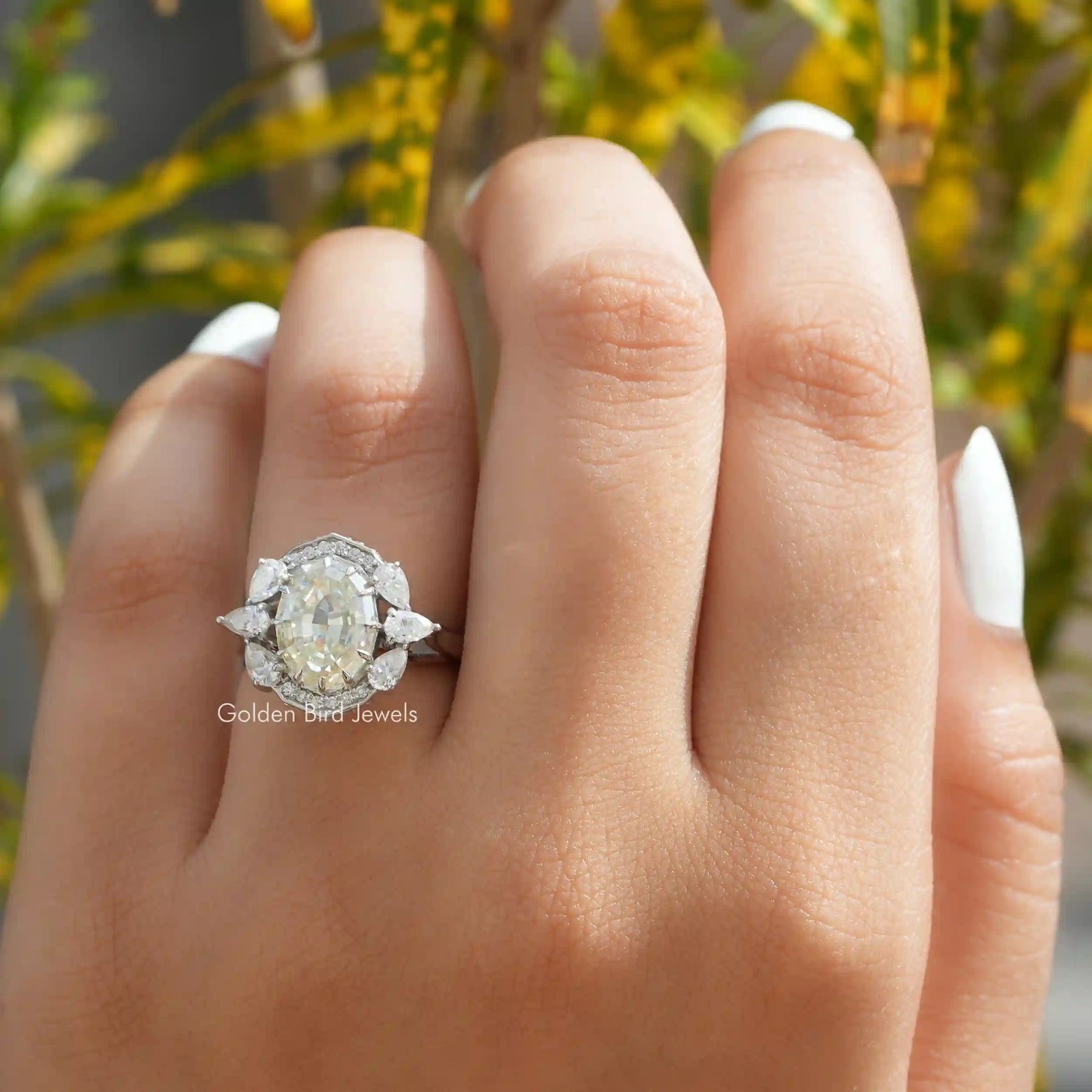 View of Moissanite Step Cut Oval Halo Vintage Ring In Finger