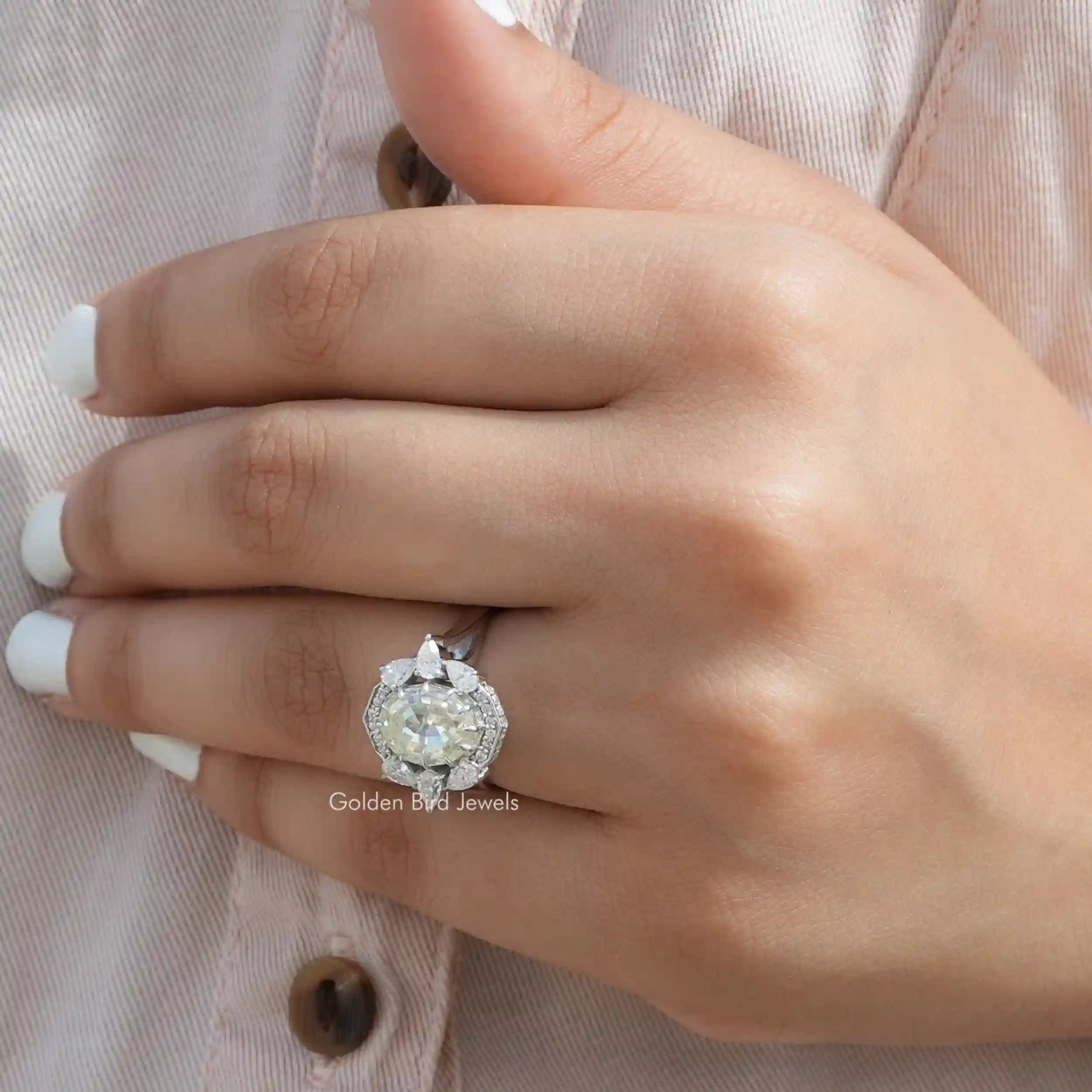 View of Oval And Pear Cut Moissanite Halo Vintage Ring In Finger