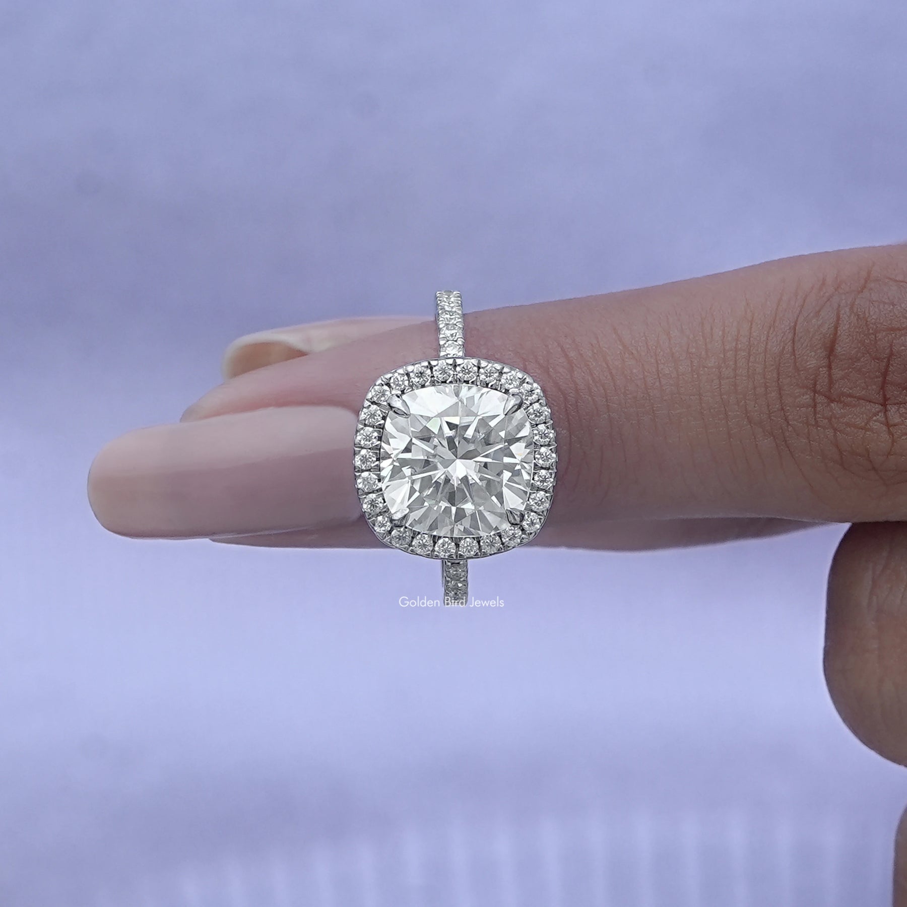In finger front View of Cushion Cut Diamond Halo Engagement Ring In White Gold