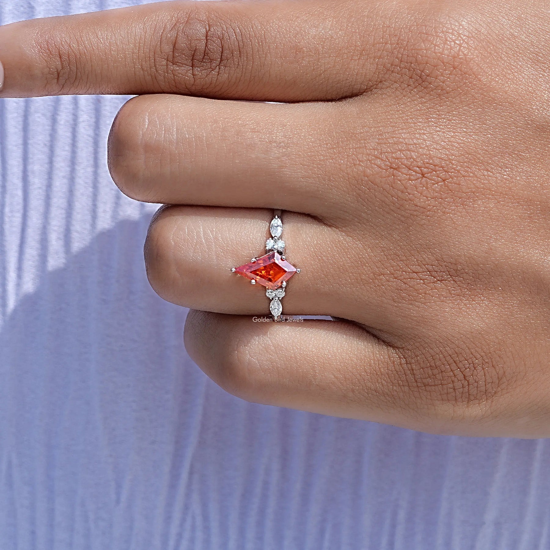Close-Up View of Orange Kite Cut Gemstone Accent Ring In White Gold