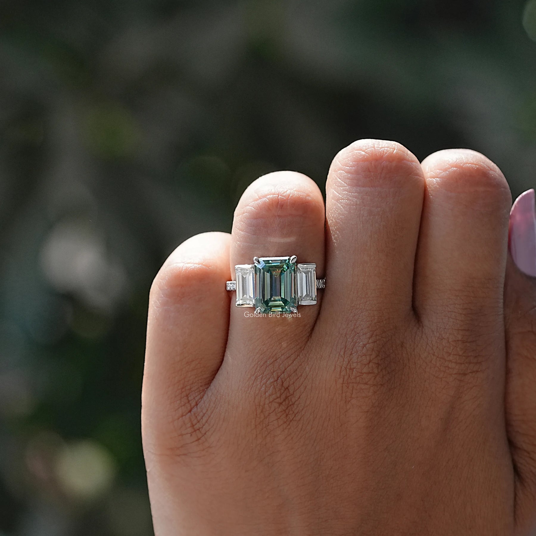 Close-Up View of Moissanite Emerald And Baguette Cut Ring In White Gold