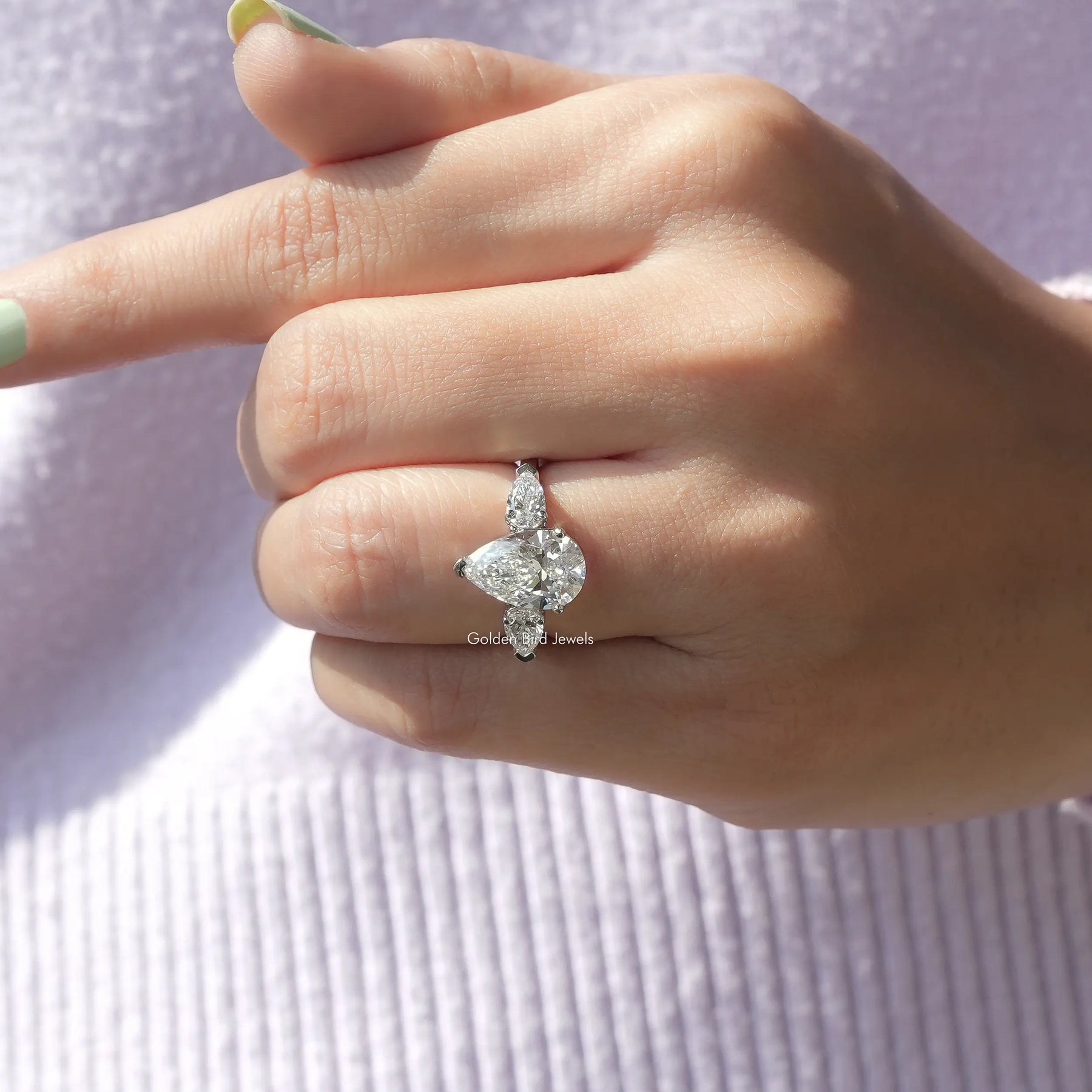 Pear Cut Lab Grown Diamond Engagement Ring In finger