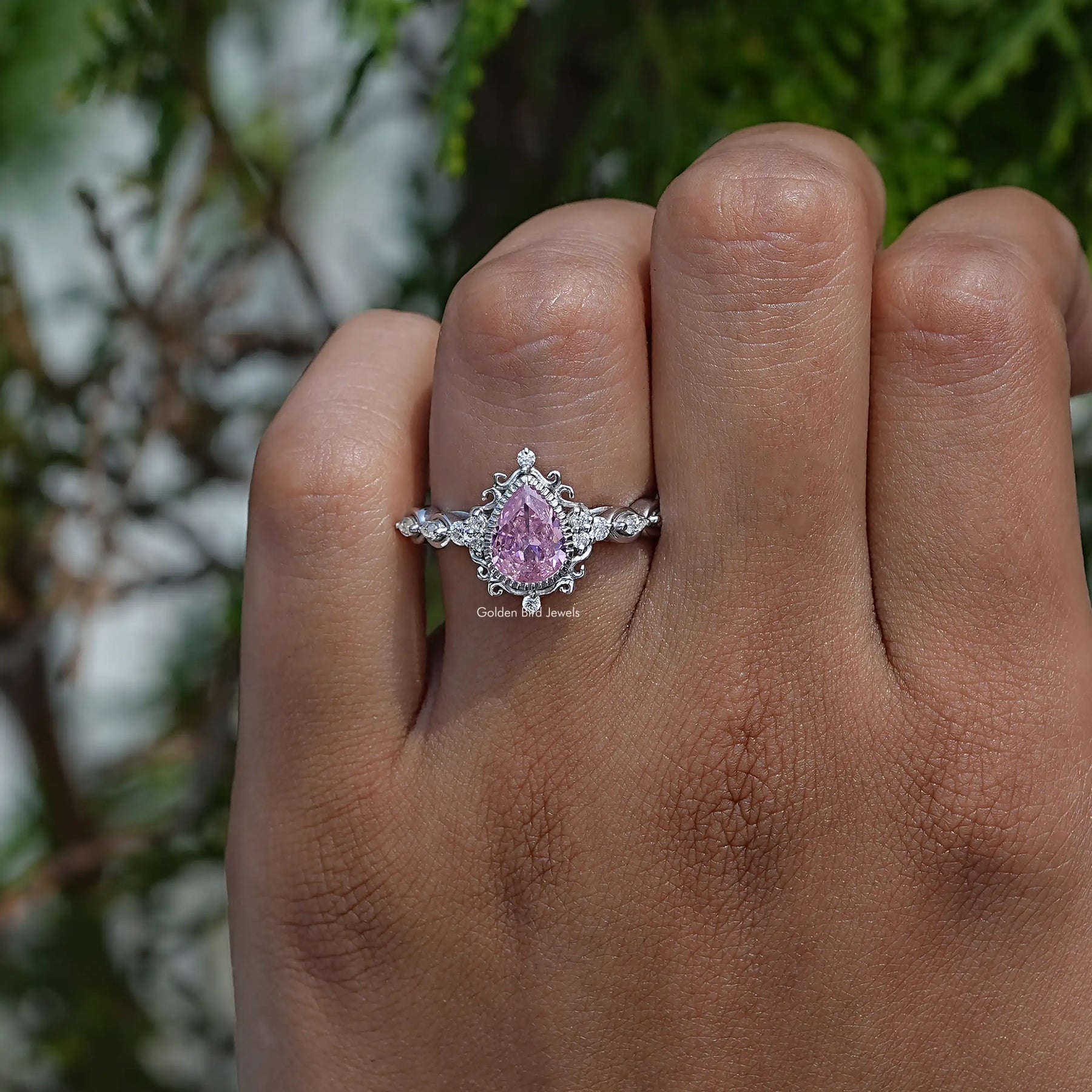 Detailed View Of Pear Cut Gemstone Accent Stone Ring