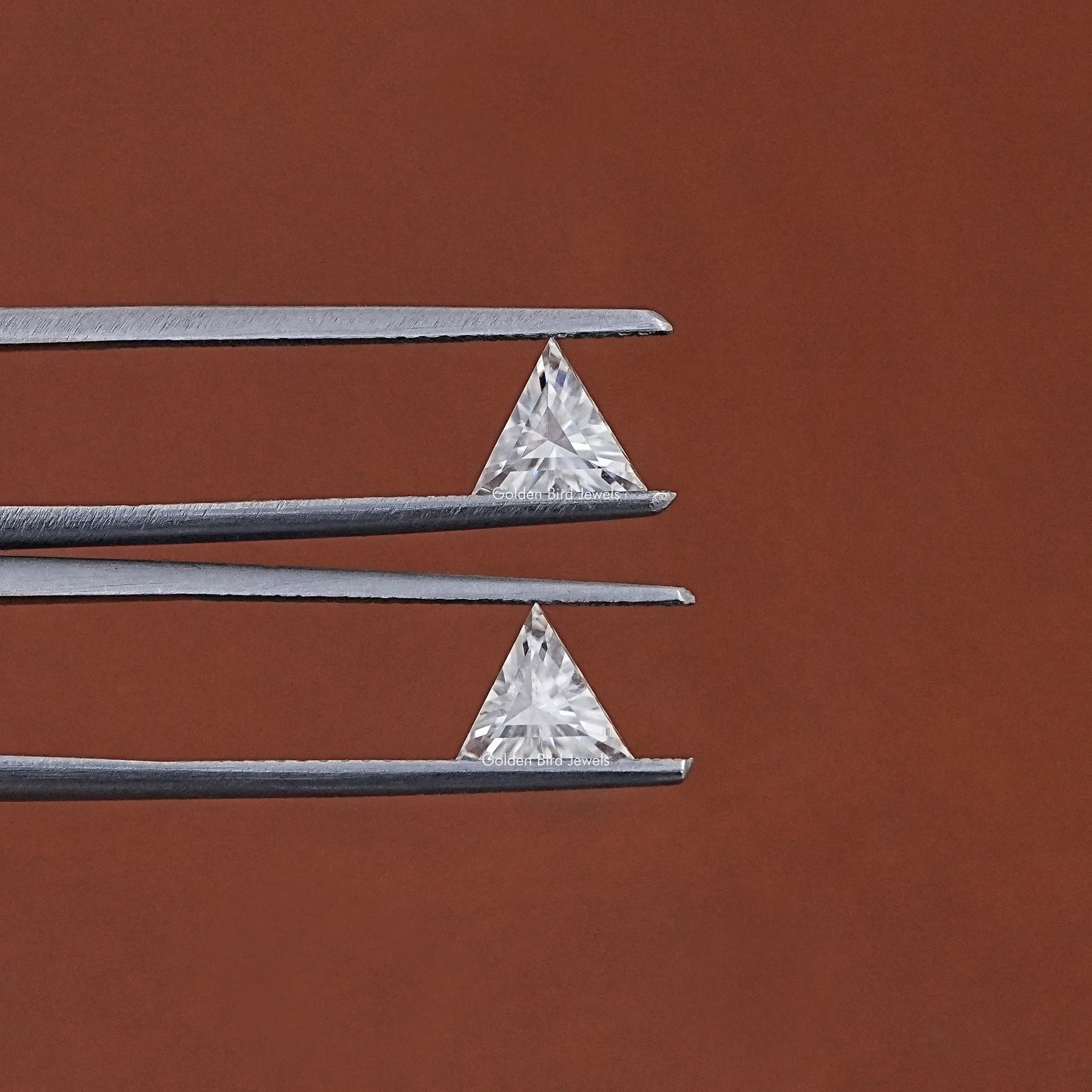 In Tweezer View Of Triangle Cut Loose Moissanite Matching Pair
