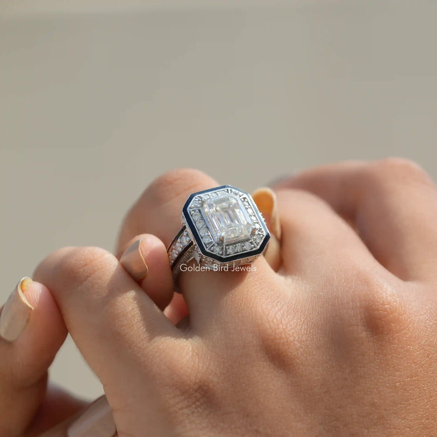 Emerald Cut Moissanite Halo Engagement Ring In Finger