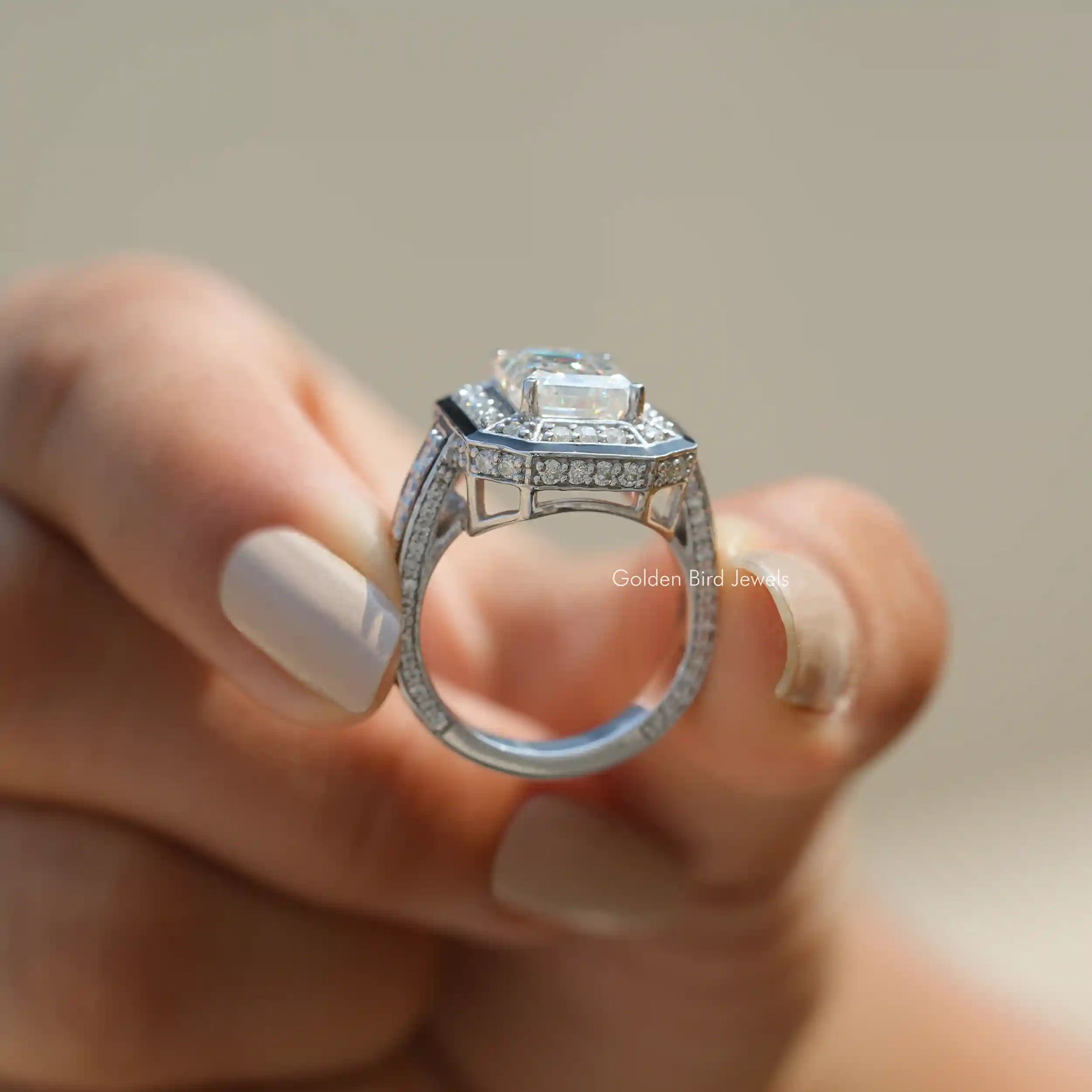 Back View of Emerald Cut Moissanite Vintage Style Ring In two fingers