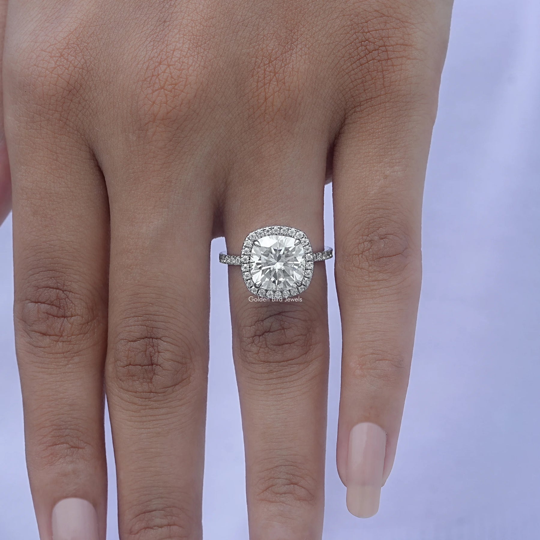 Close-Up View of Cushion Cut Diamond Halo Engagement Ring In White Gold
