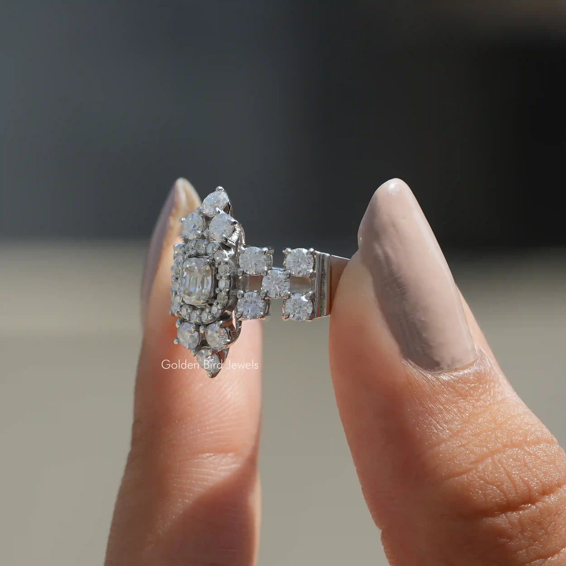 Front View of Moissanite Cushion Cut Vintage Style Cluster Ring In two Fingers