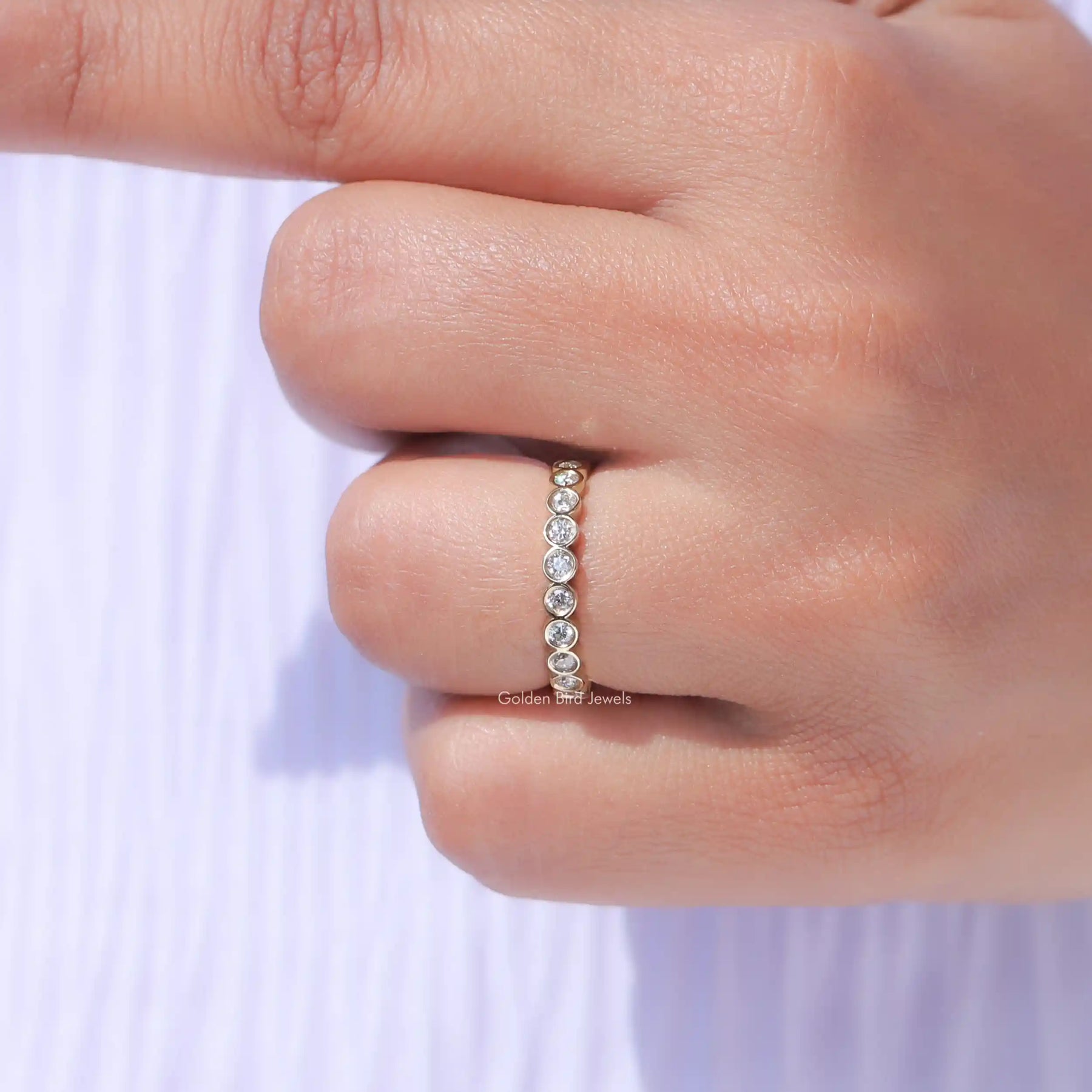 View of Round Cut Diamond Bezel Set Full Eternity Band In White Gold