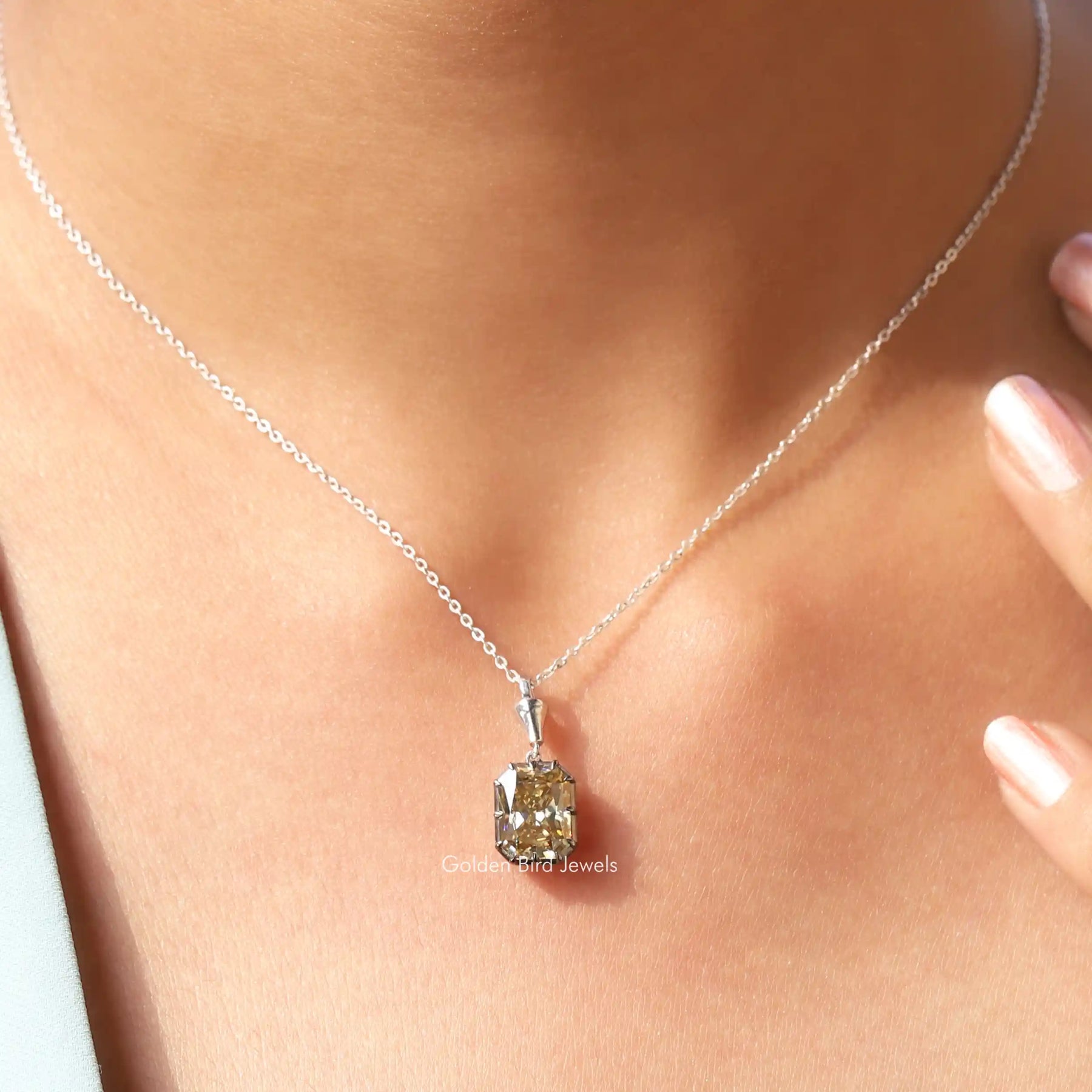 In front view of moissanite Radiant cut pendant