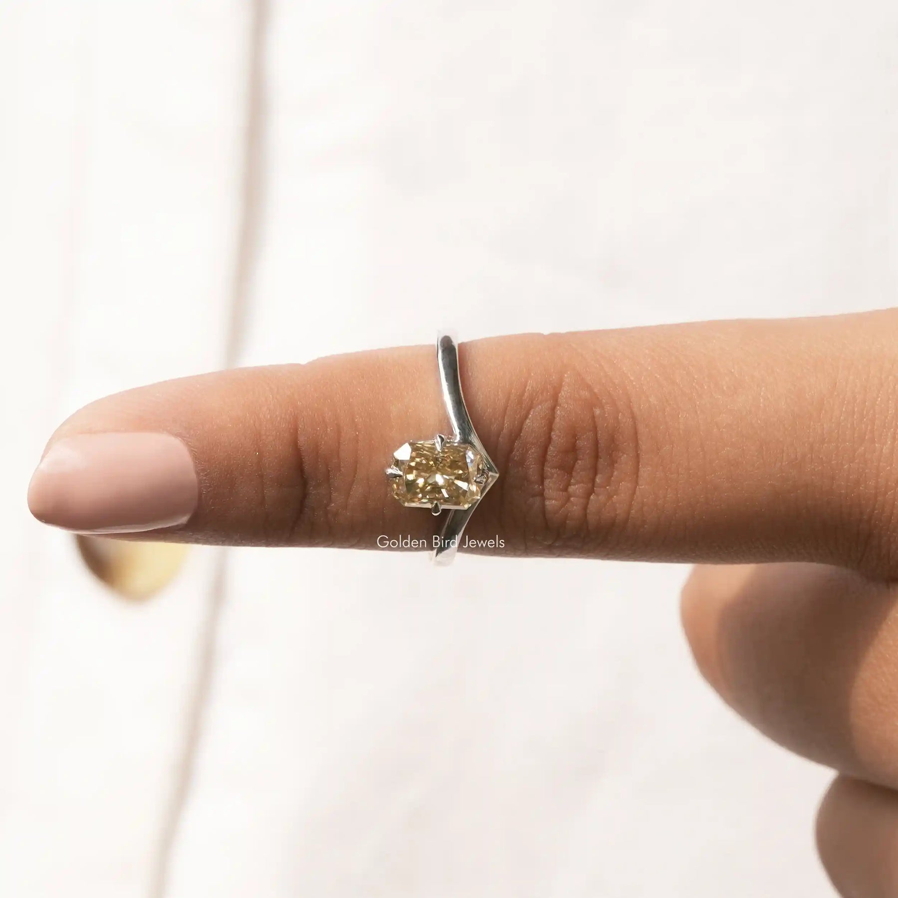 In finger front View of Radiant Cut Moissanite Solitaire Ring