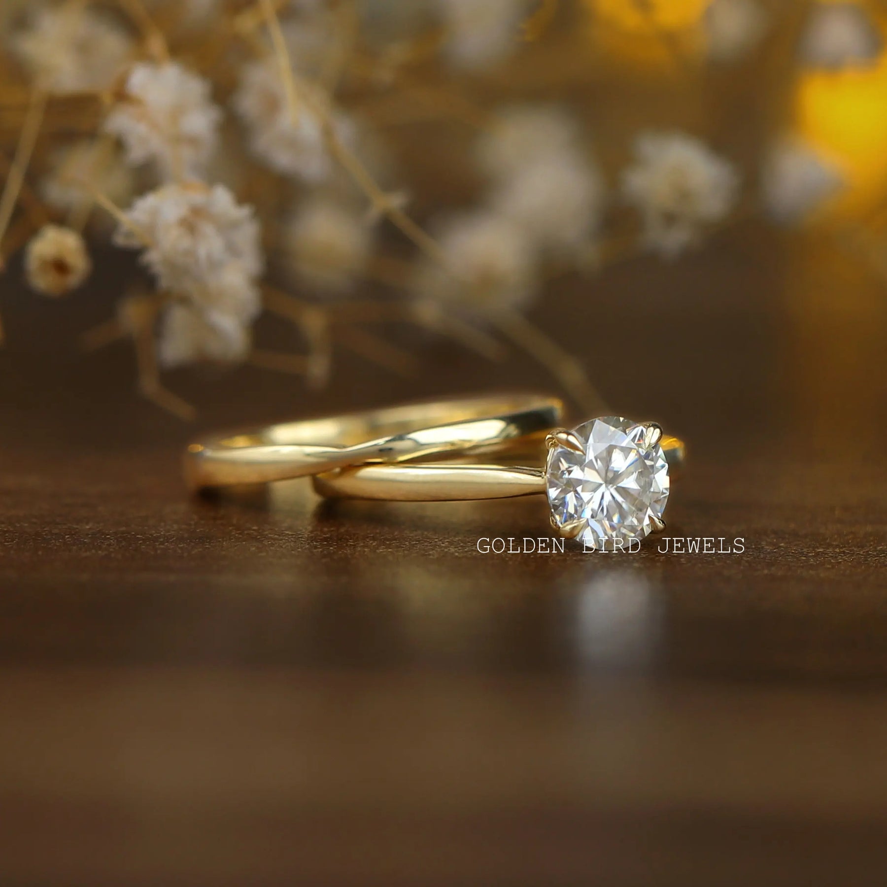 View of Round Cut Moissanite Engagement Ring In Yellow Gold
