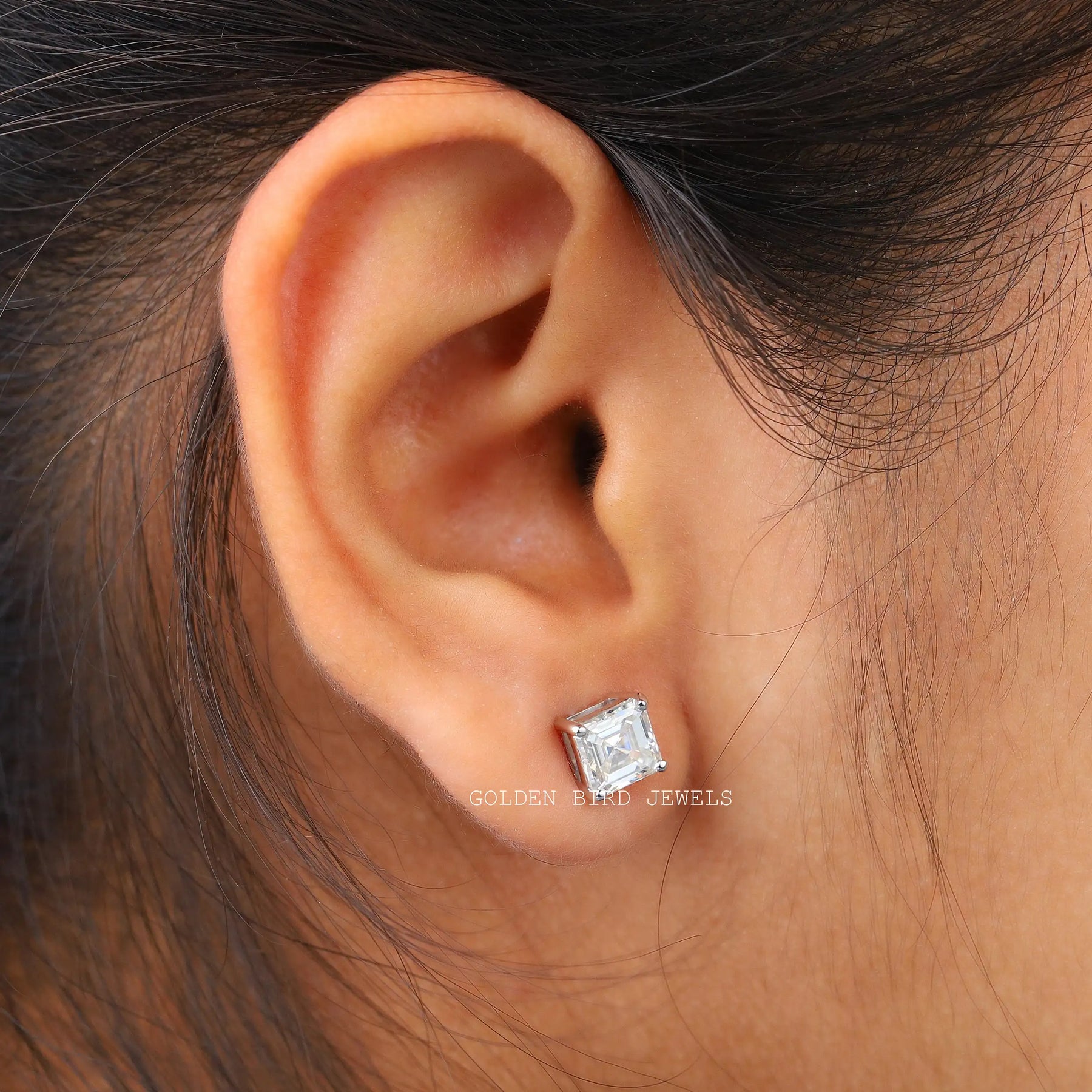 In ear view of asscher cut cluster moissanite earrings