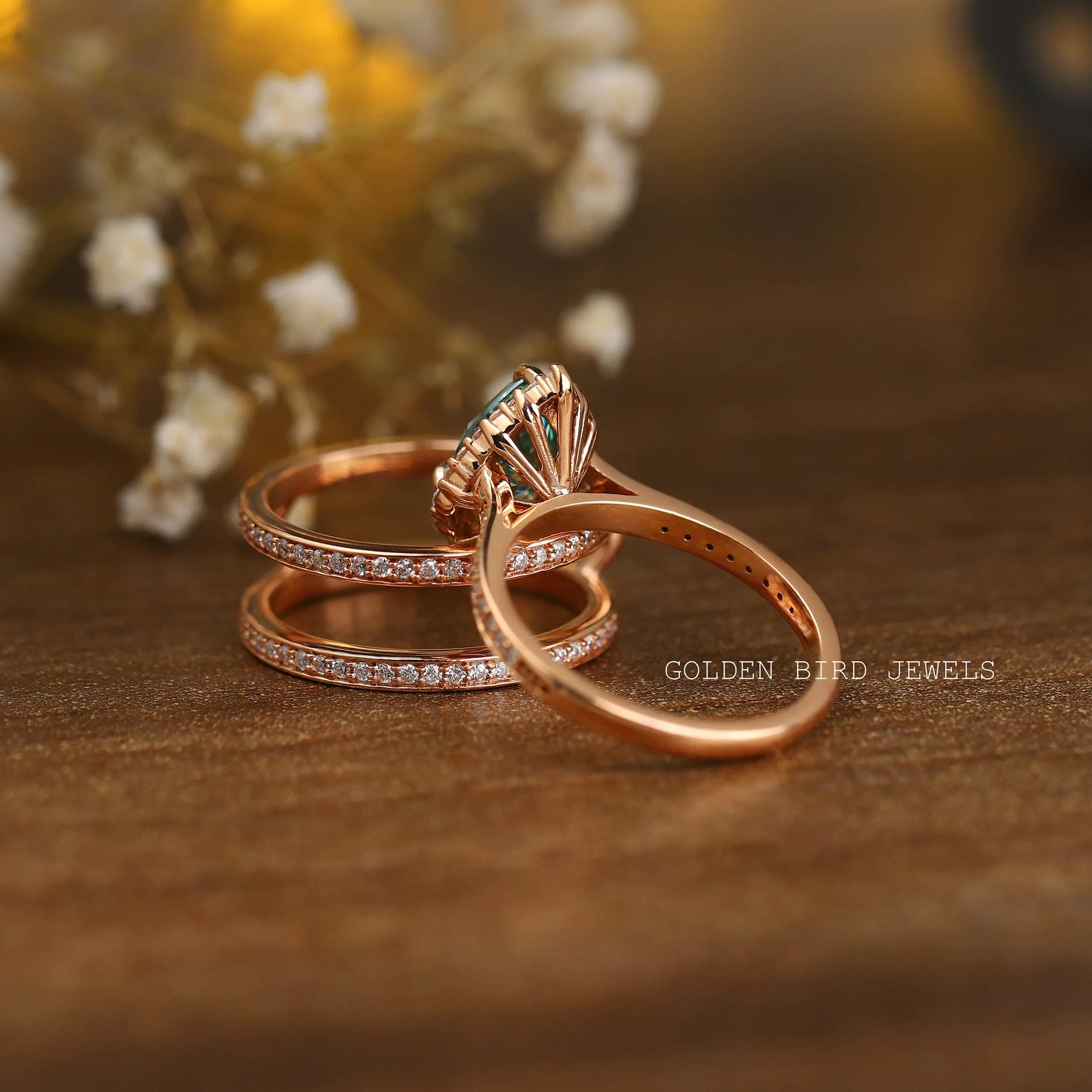 Back view of a pear-cut blue stone ring in prongs setting